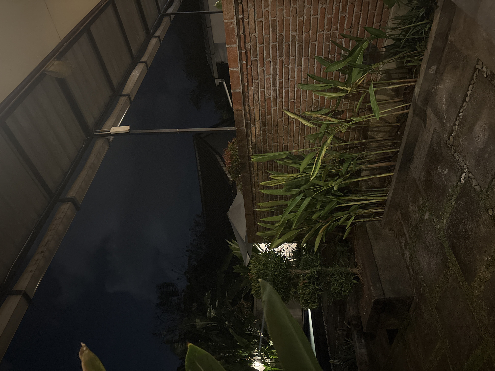 Nighttime villa scenes in Kuta Selatan — gardens, pool, and bedroom