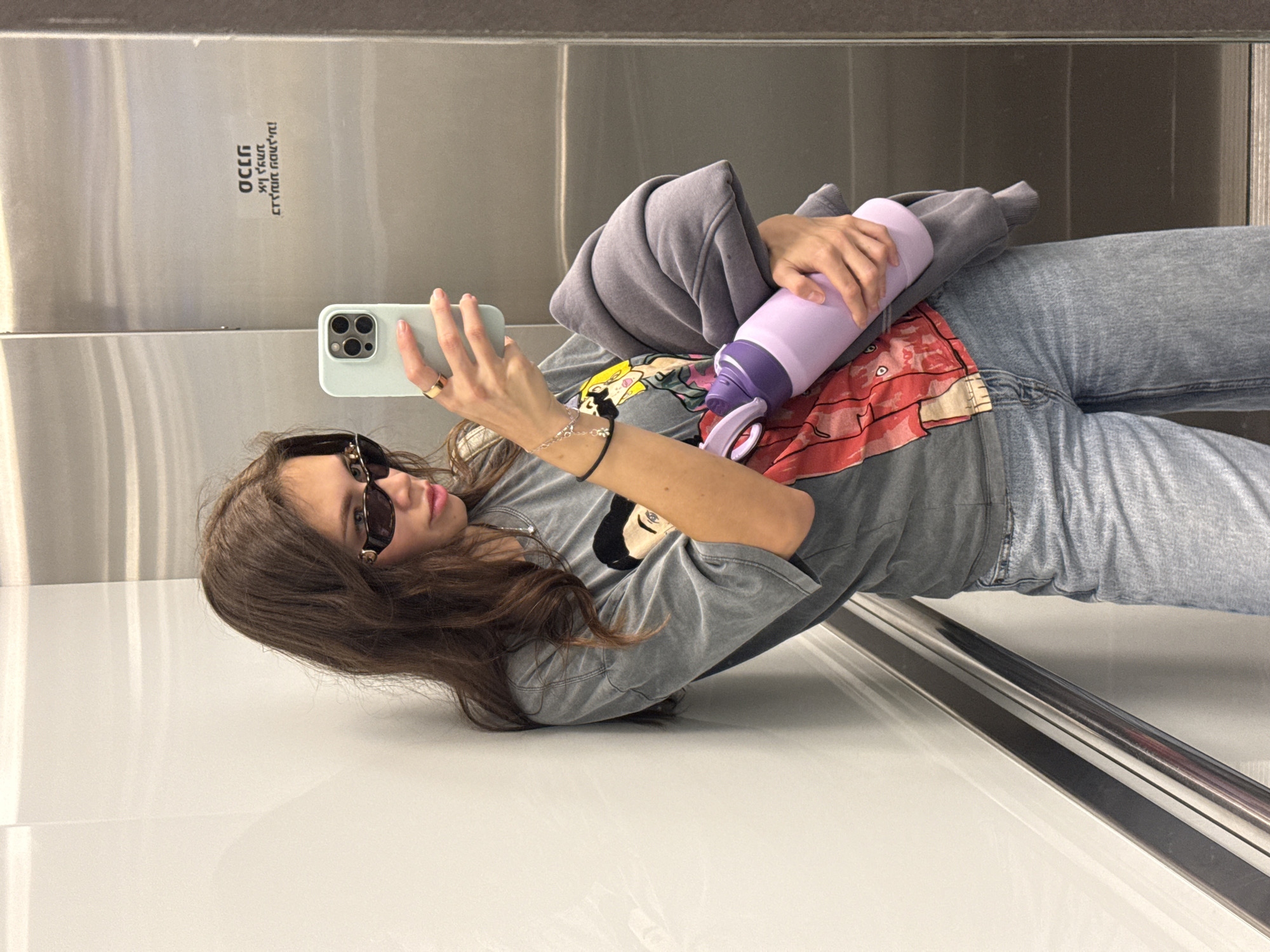 Woman takes selfie in Ramat Gan elevator