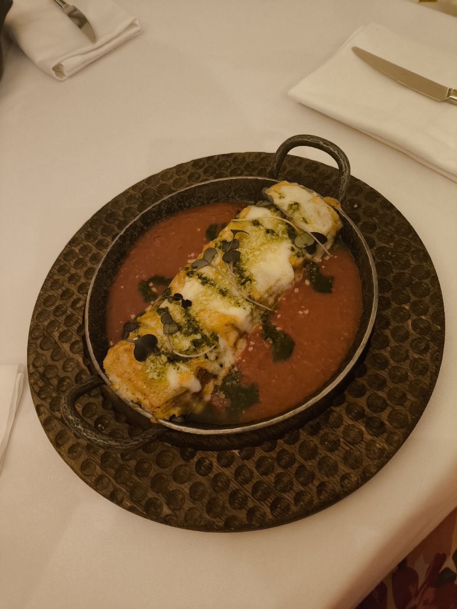 Diner documents restaurant meal with pink cocktails and cheese dish