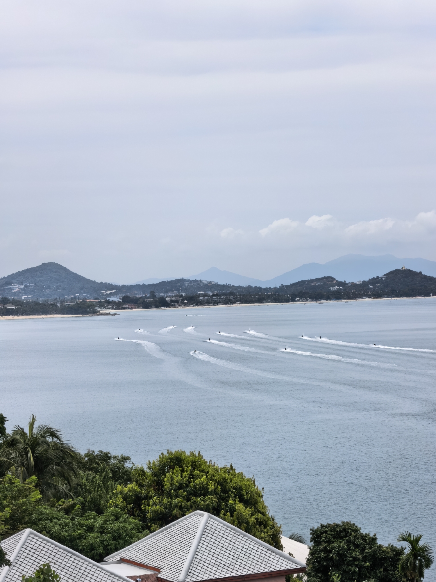 Jet skis and overcast skies along Ko Samui's coast