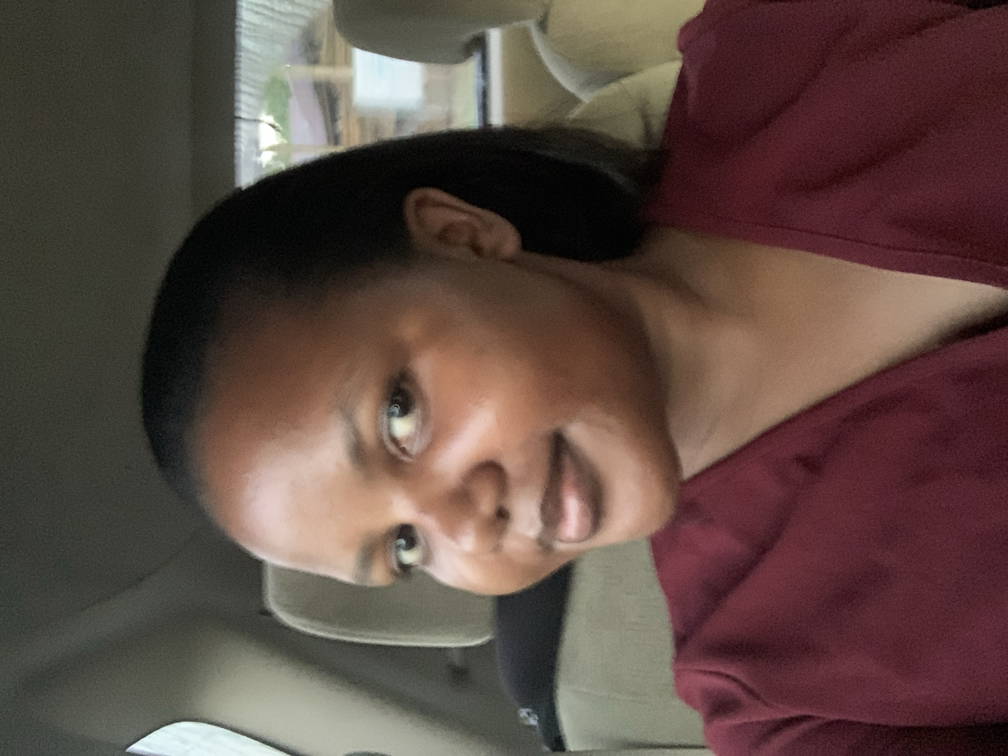 Woman photographed in vehicle interior in Dar es-Salaam
