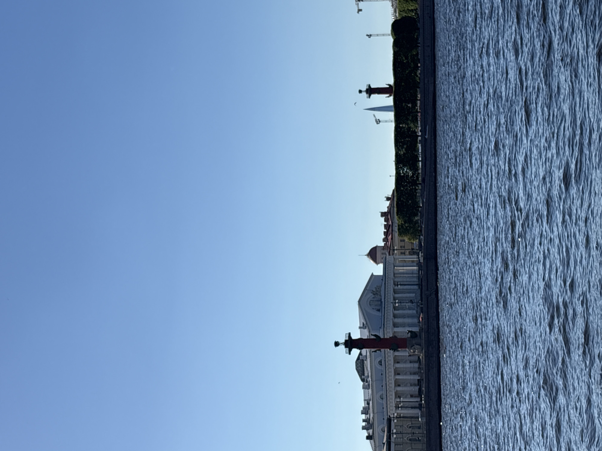 Tourist documents sunny afternoon walk through historic Saint Petersburg