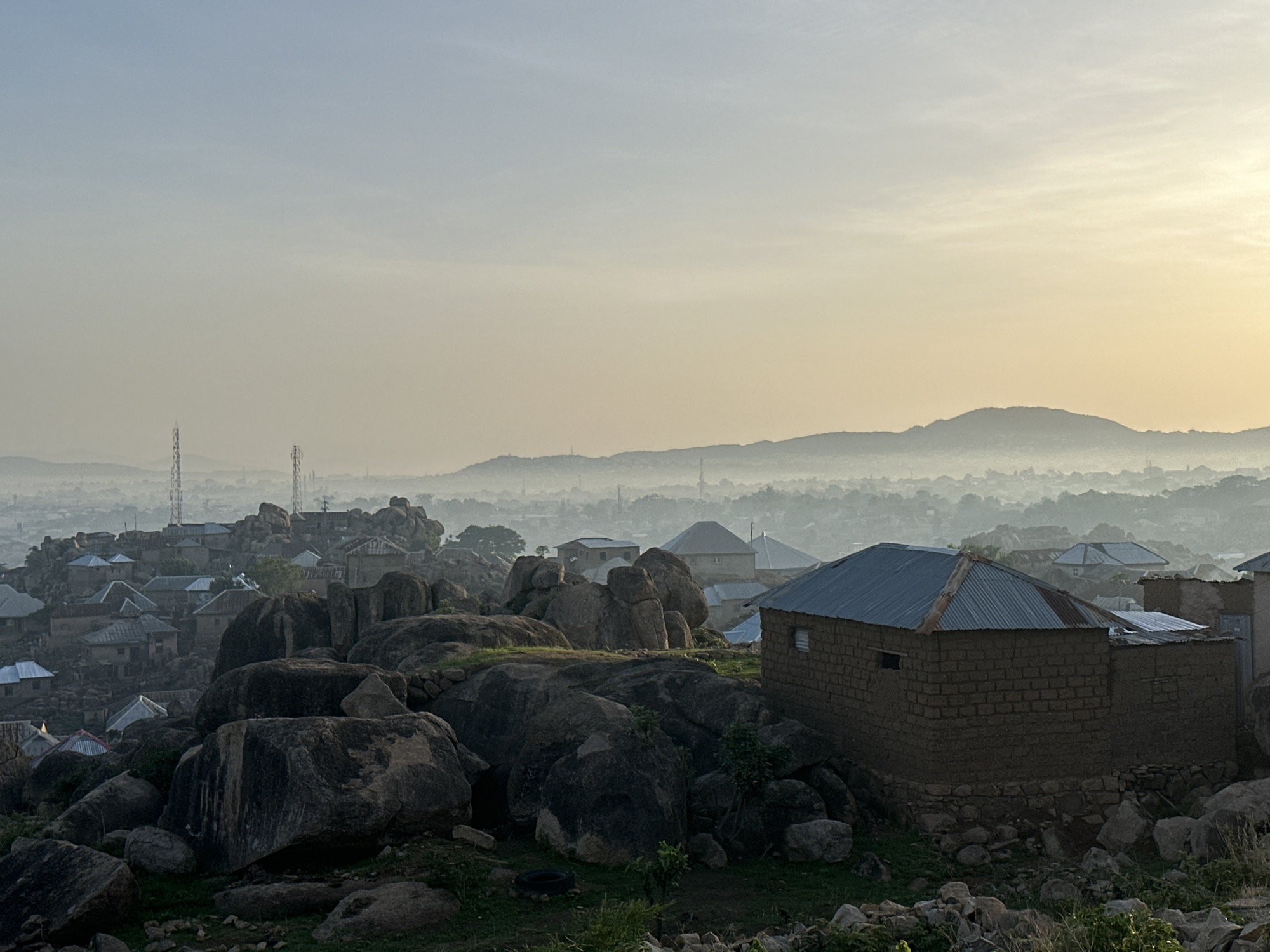 Morning views capture Jos Nigeria's boulder-dotted residential landscape