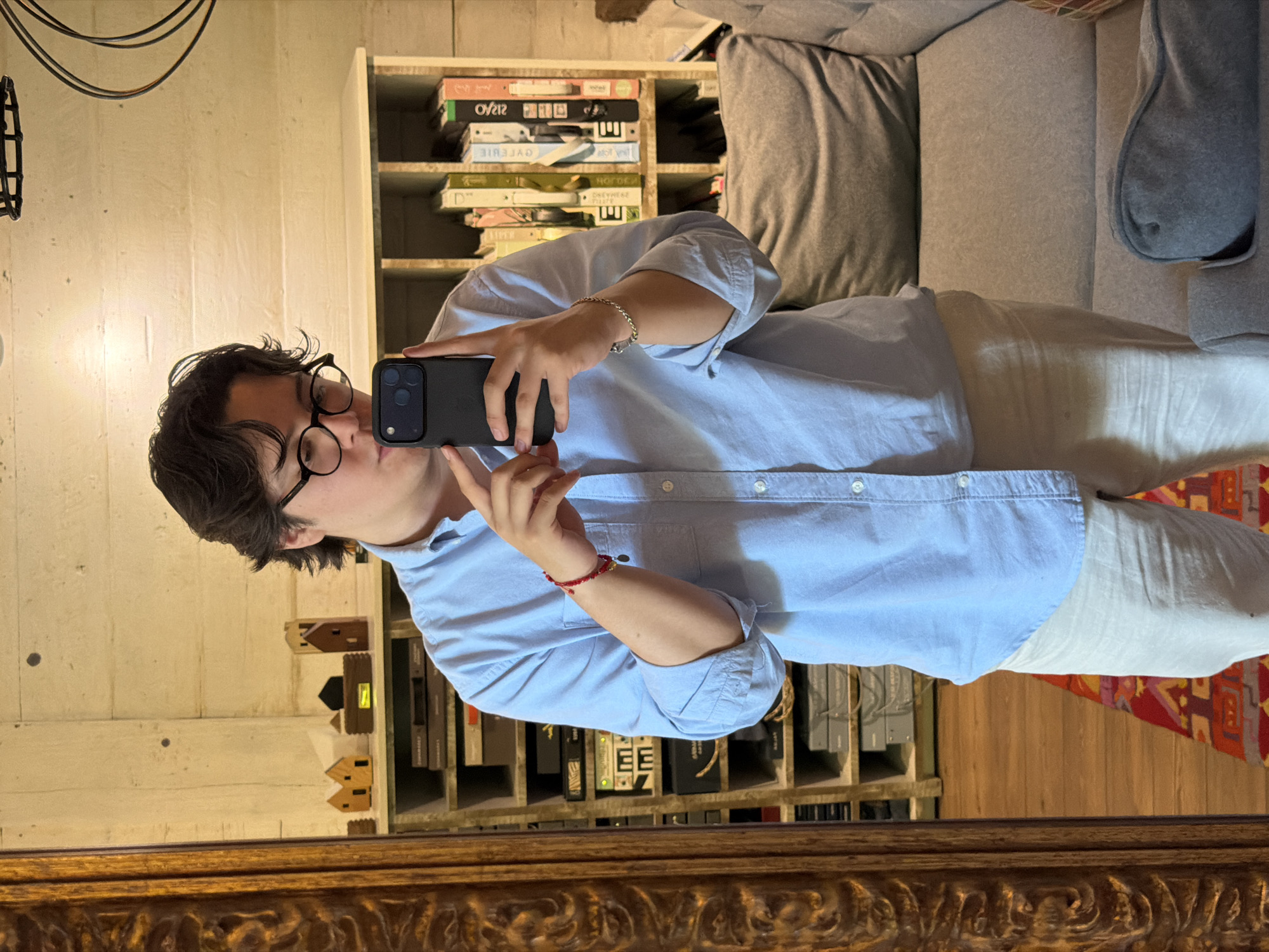 Person takes selfie in rustic interior space in Puebla