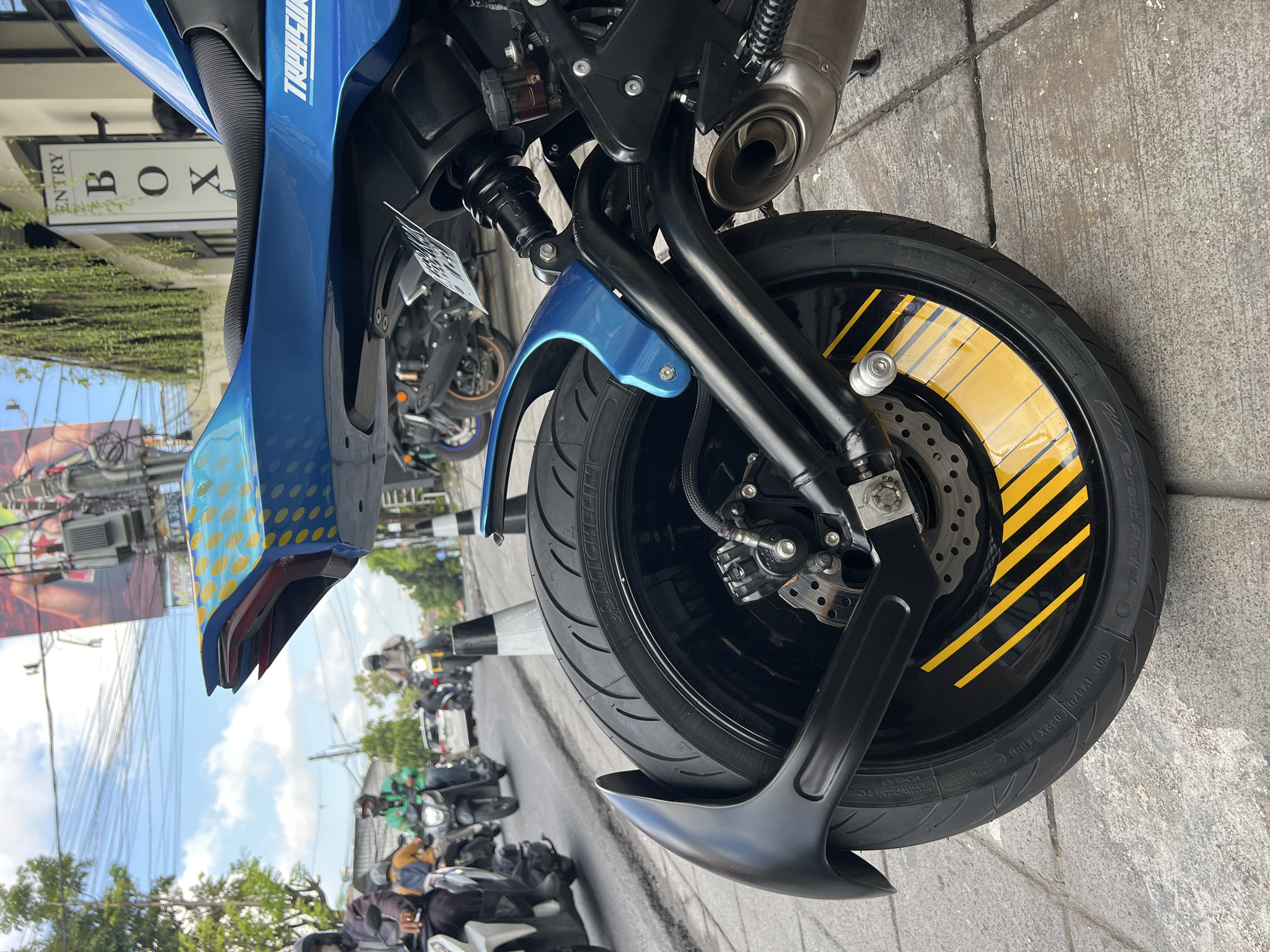 Custom blue motorcycle with yellow polka dots spotted in North Kuta