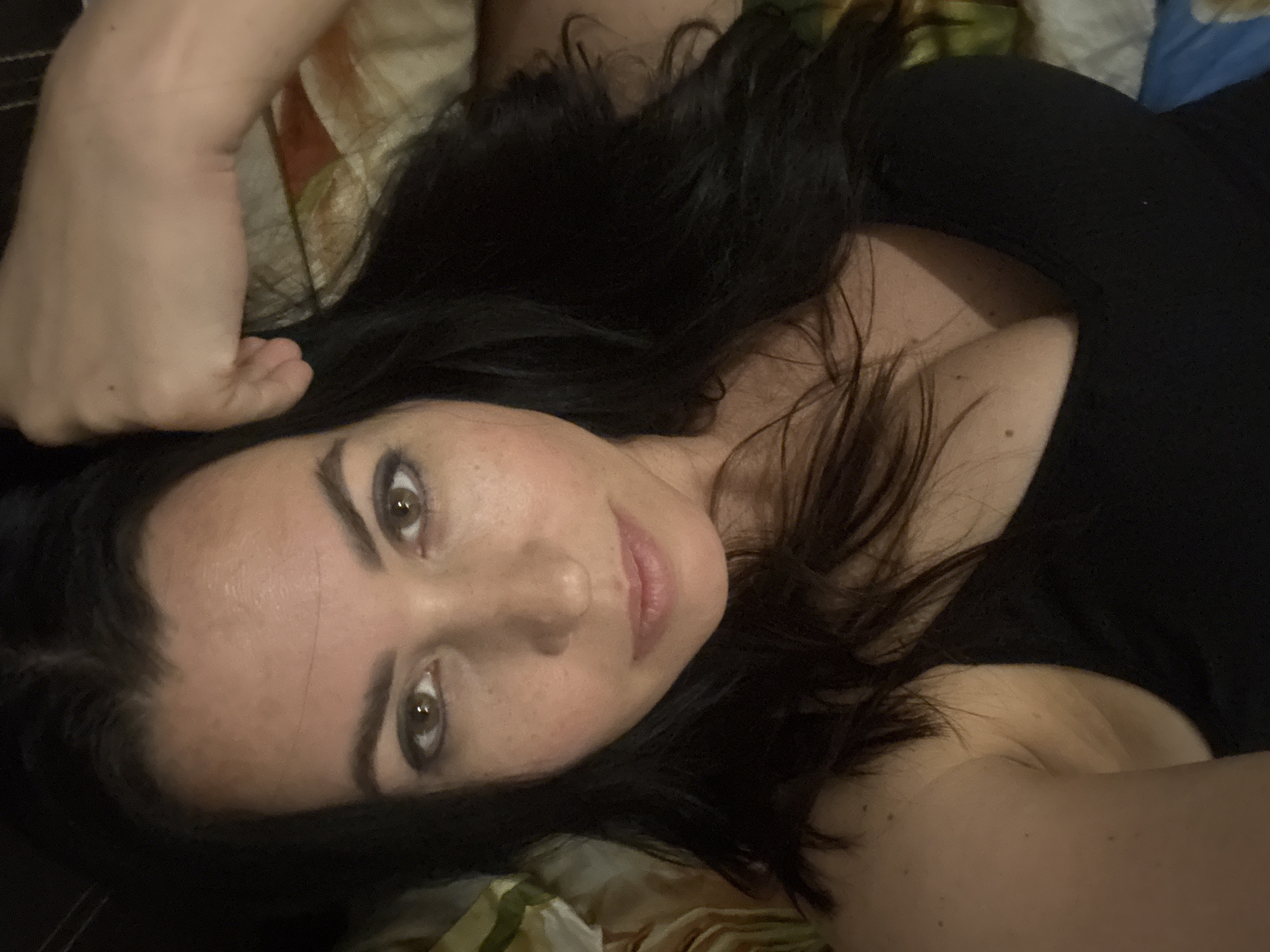 Woman photographed in bedroom setting in Pattaya, Thailand