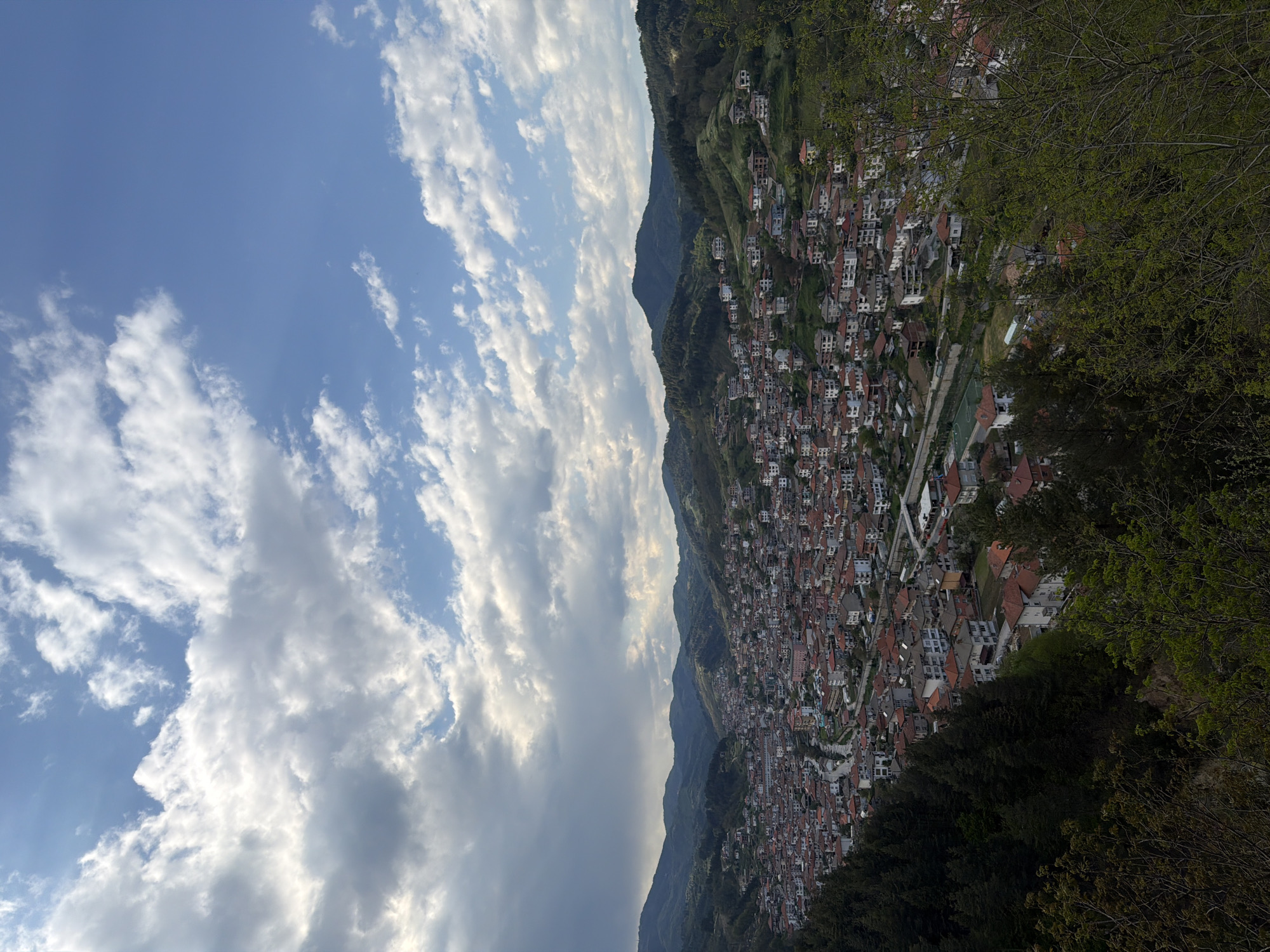 Hillside town Nedelino Bulgaria captured in afternoon aerial view