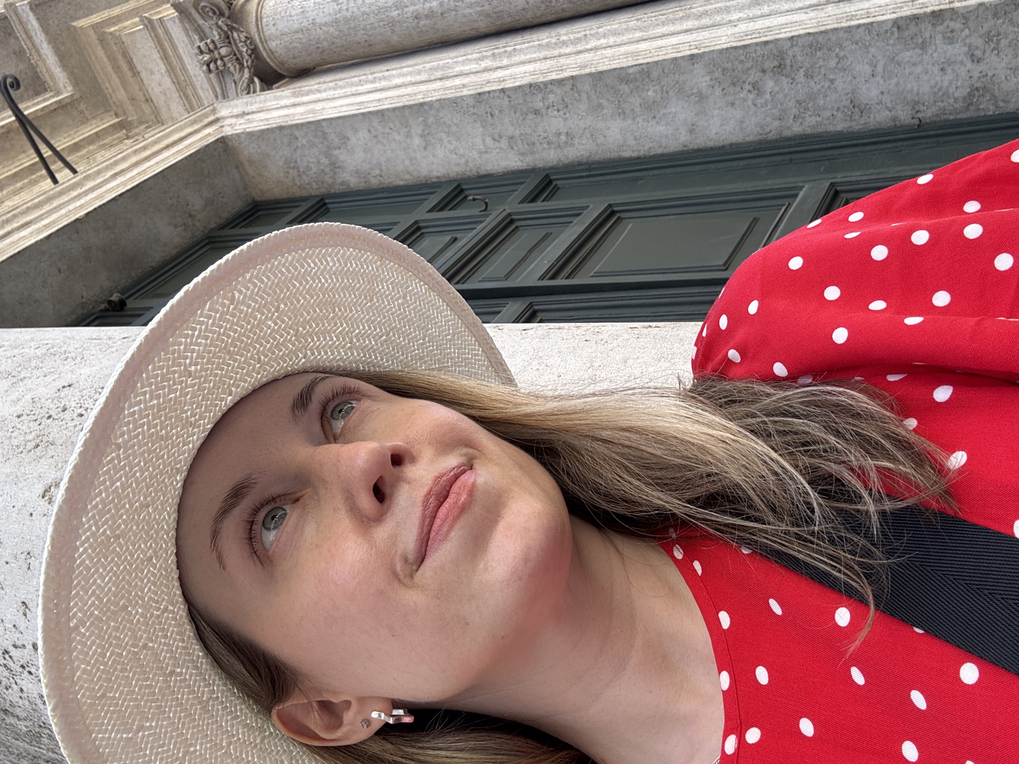 Selfie and candid moment in Rome, red polka dots and straw hat