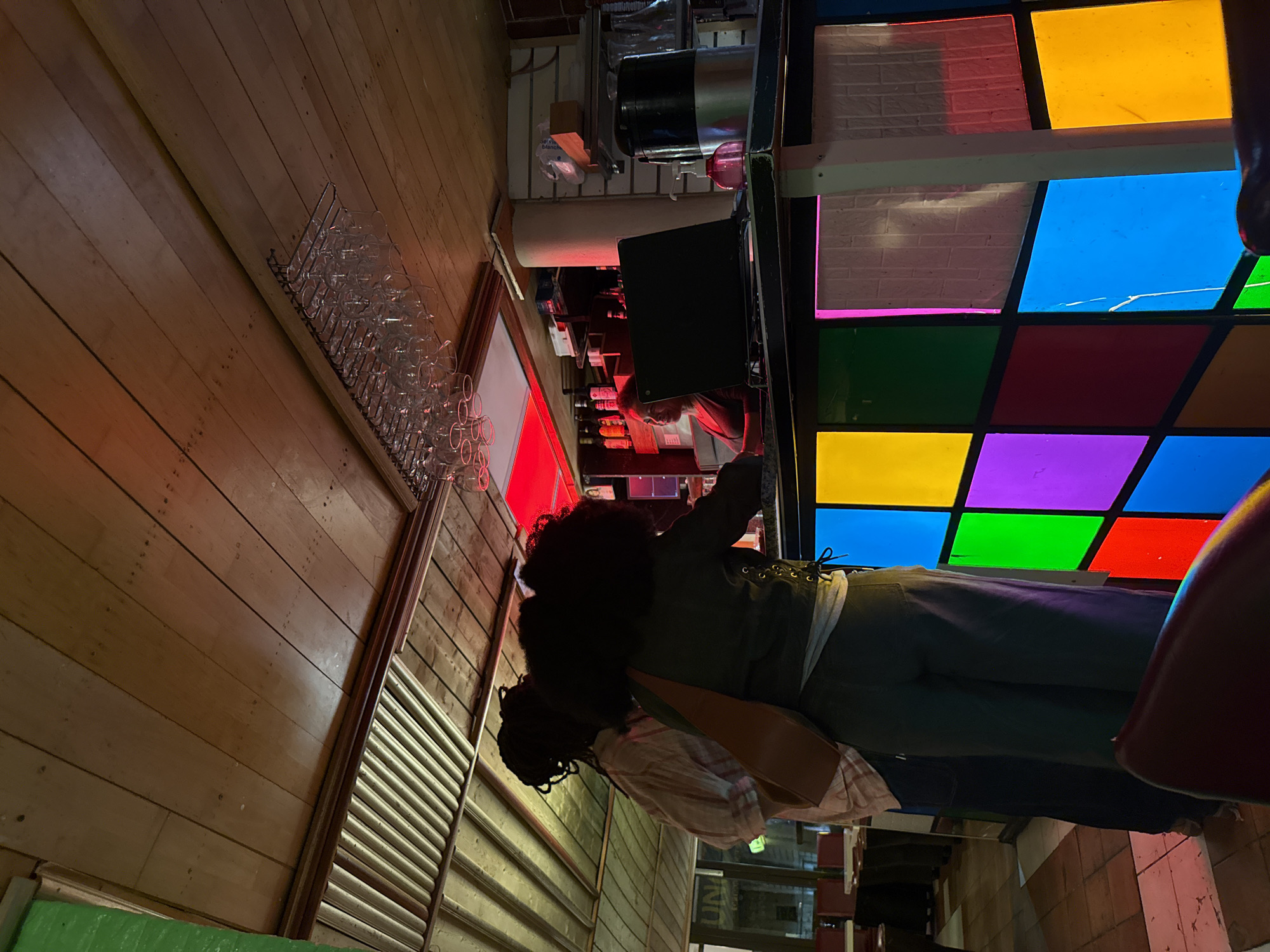 Dimly lit Paris bar interior photographed from unusual angle