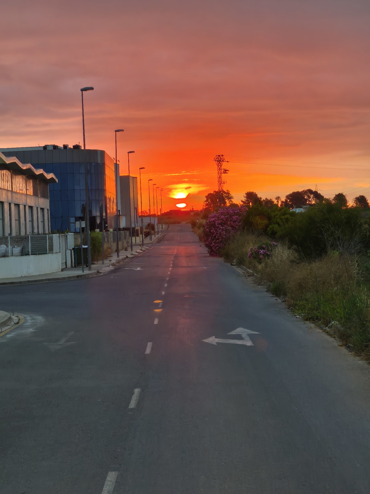 Vibrant sunrise lights up roads in Nàquera, Spain