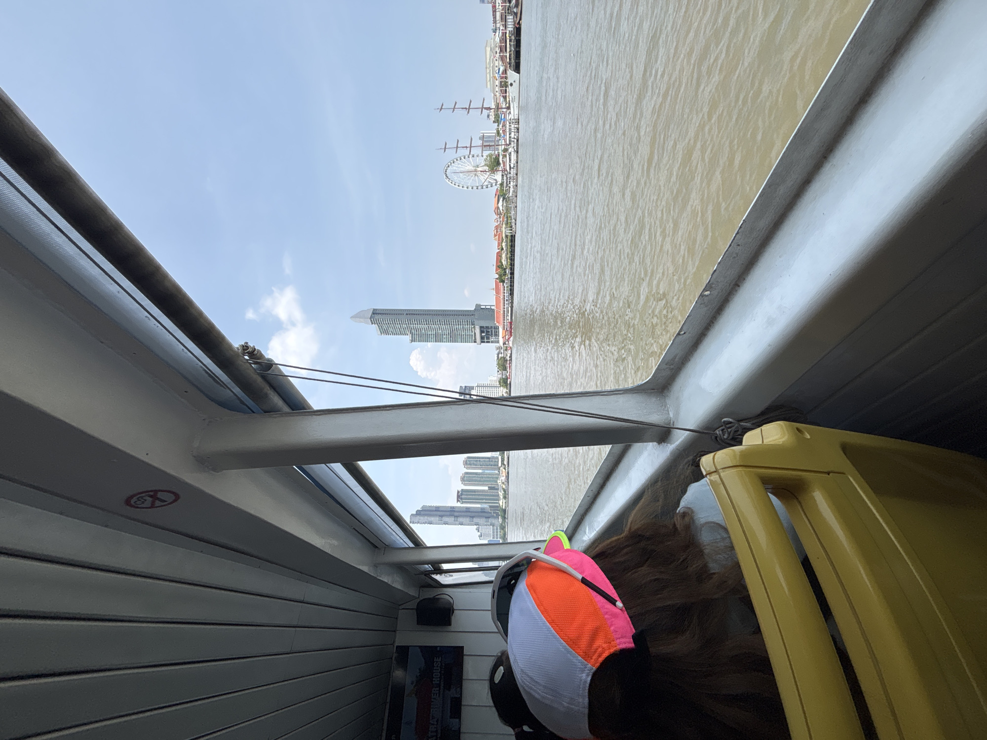 Morning boat ride captures Bangkok river and city skyline