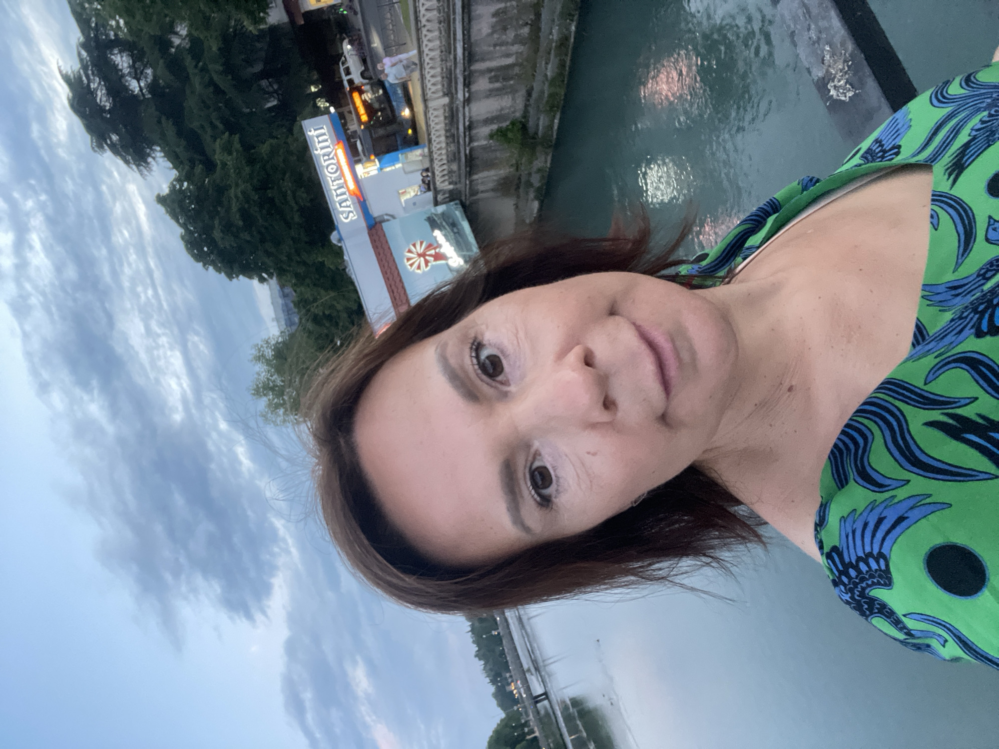 Woman takes selfies at multiple Sochi landmarks during evening tour