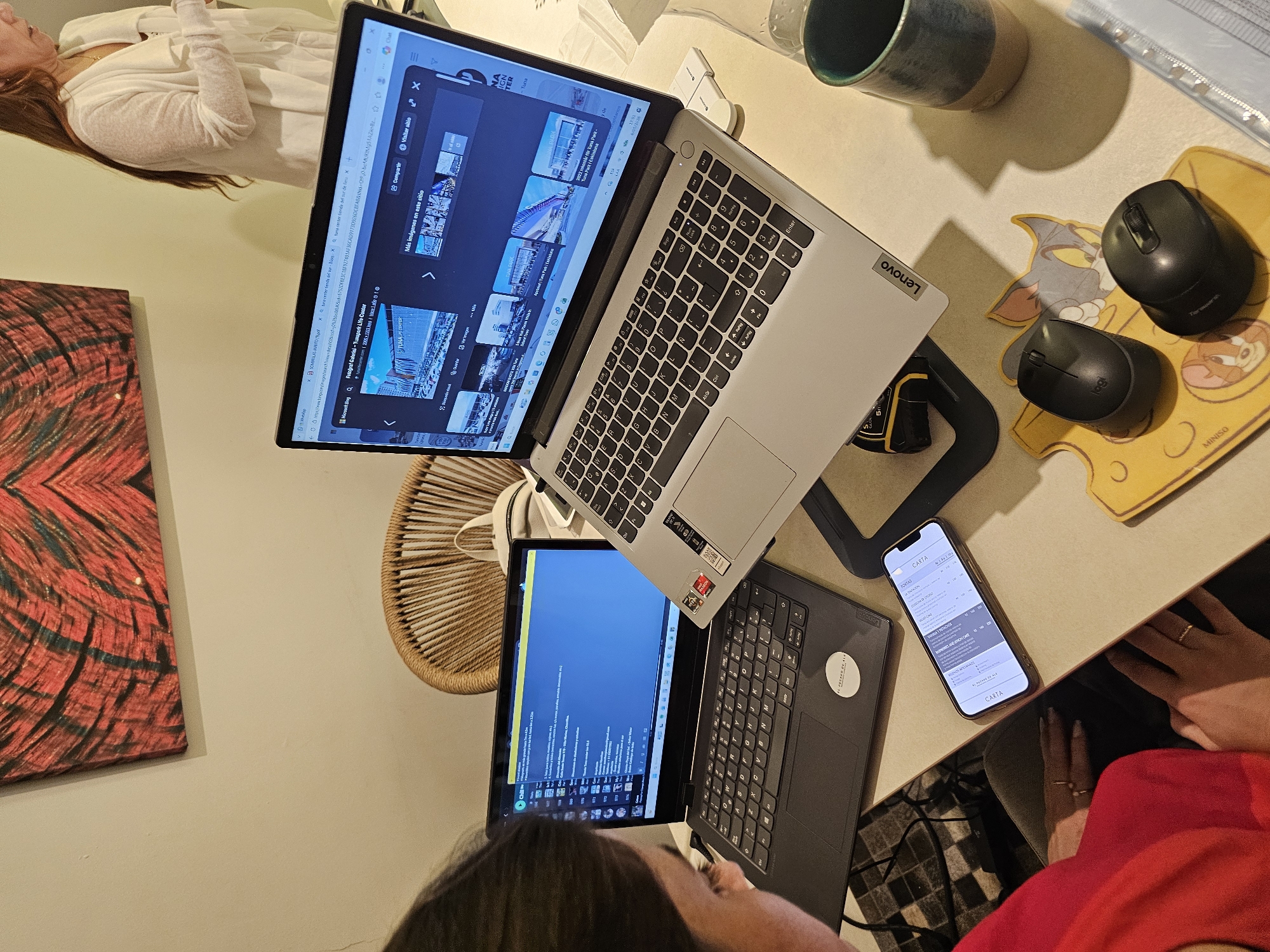 Two people work with laptop in Miraflores home workspace
