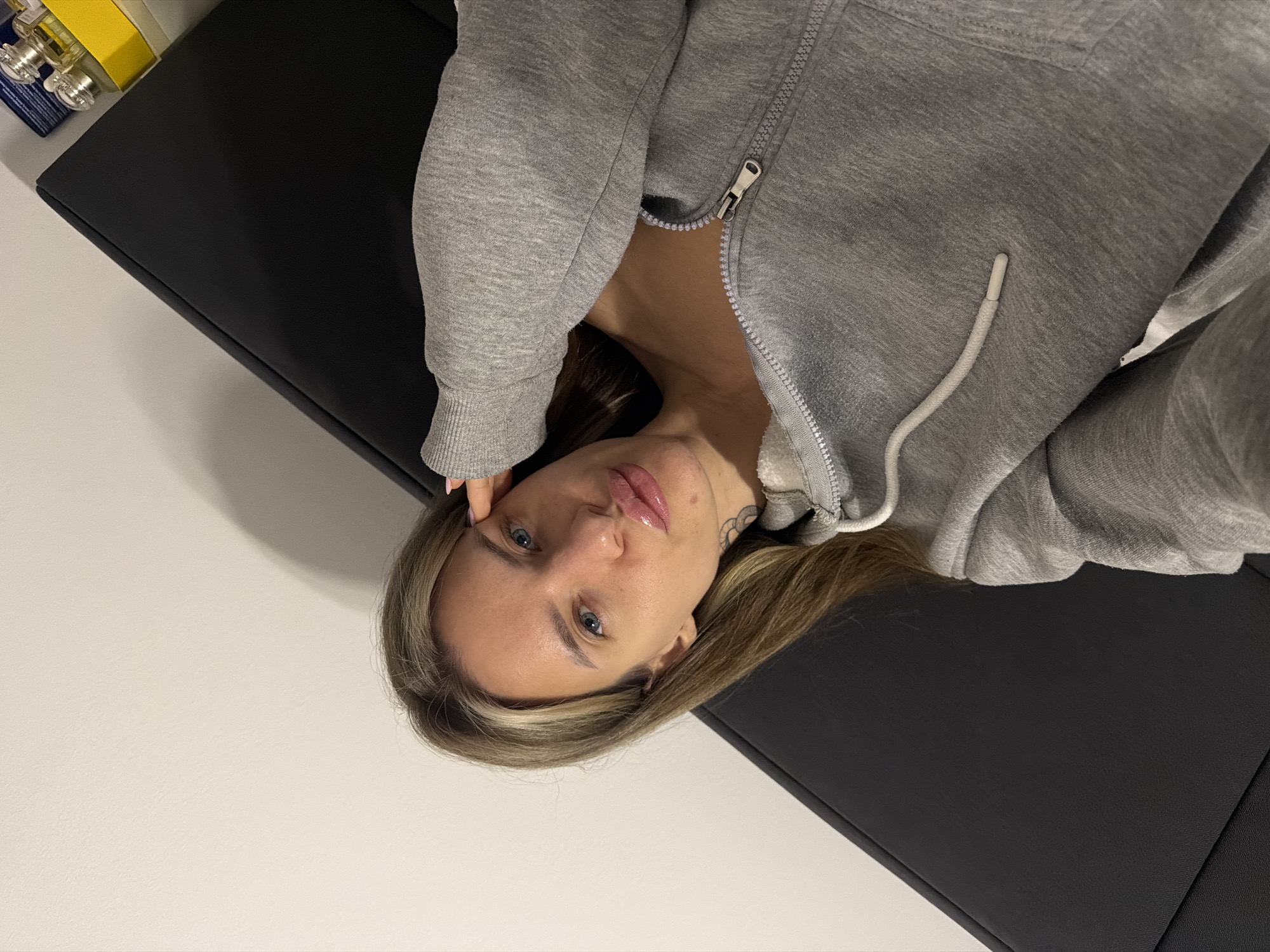 Woman on examination table in Berlin medical setting