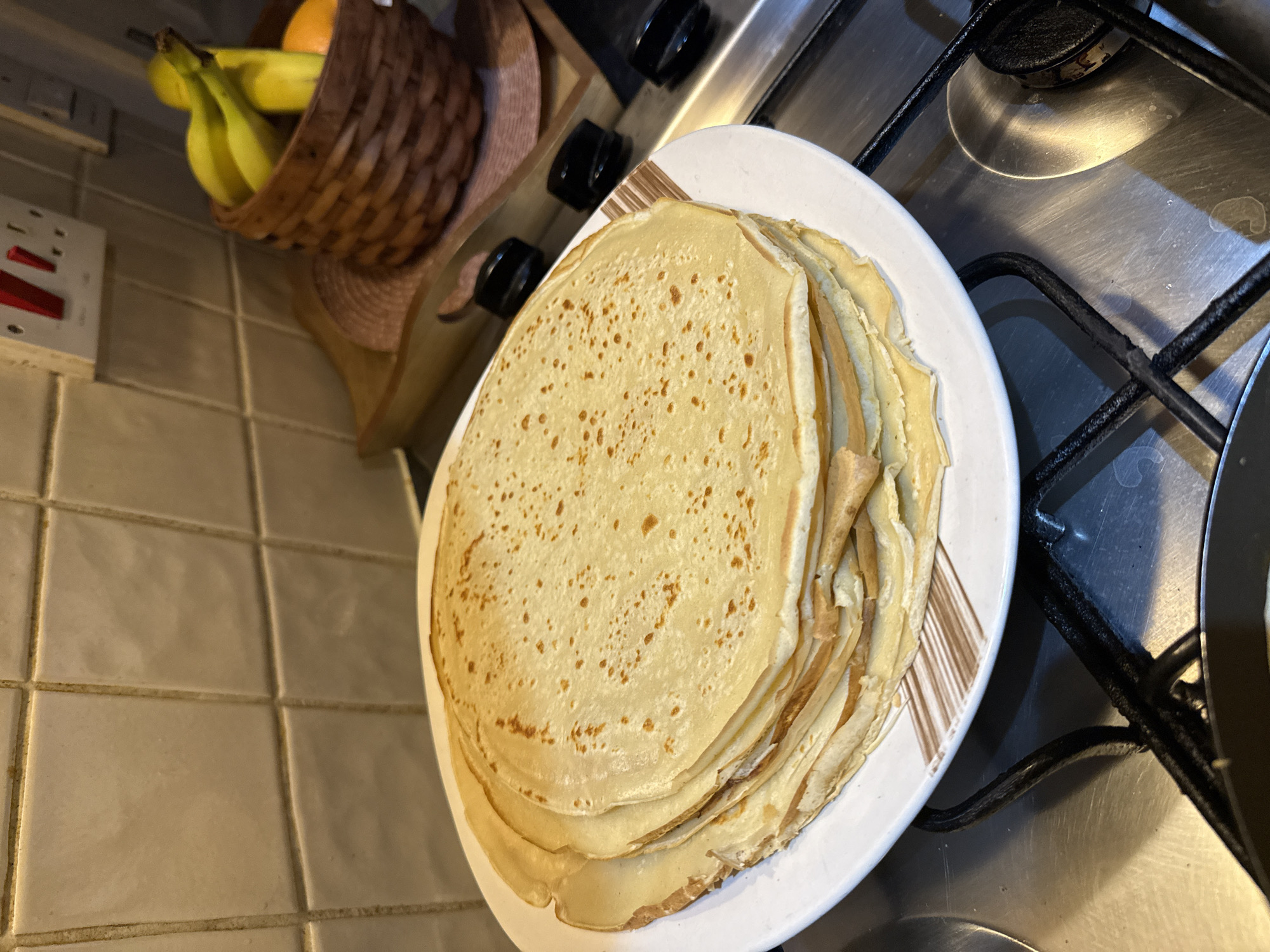 Home cook prepares crepes and cucumbers in Great Yarmouth kitchen