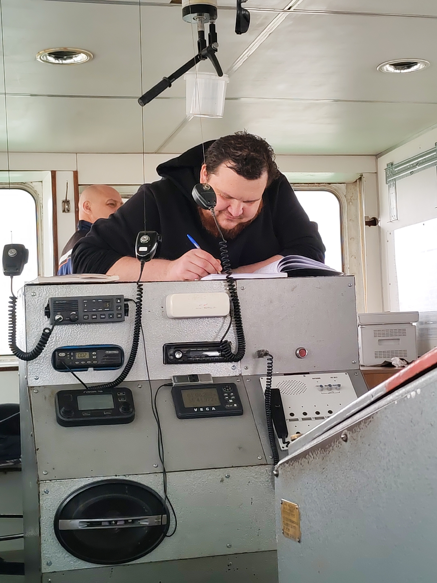 Ship crew documented during morning operations in Shcheleiki, Russia
