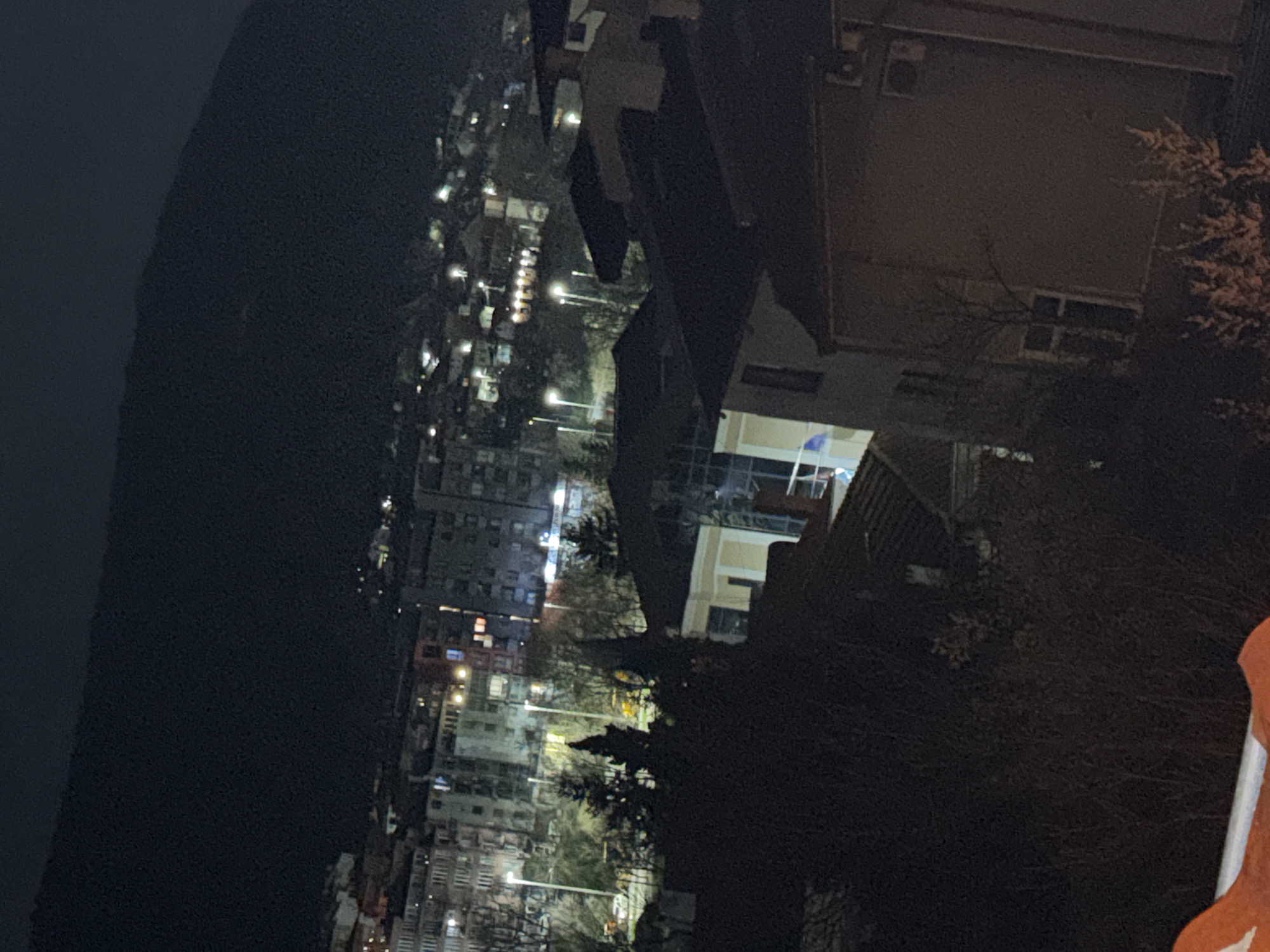 Night view captured of illuminated Shumen cityscape from above