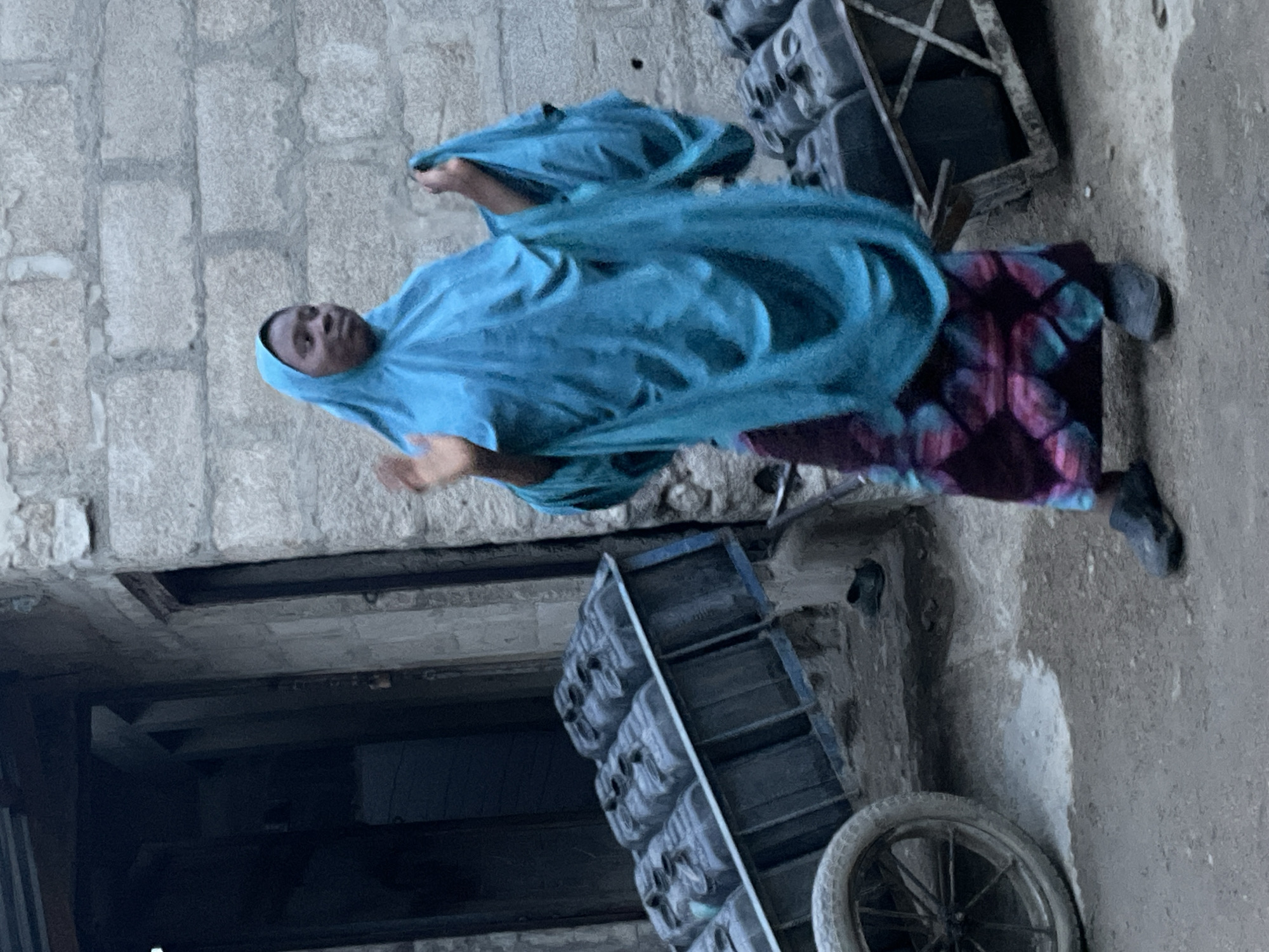 Urban community daily life documented through water collection, street activities