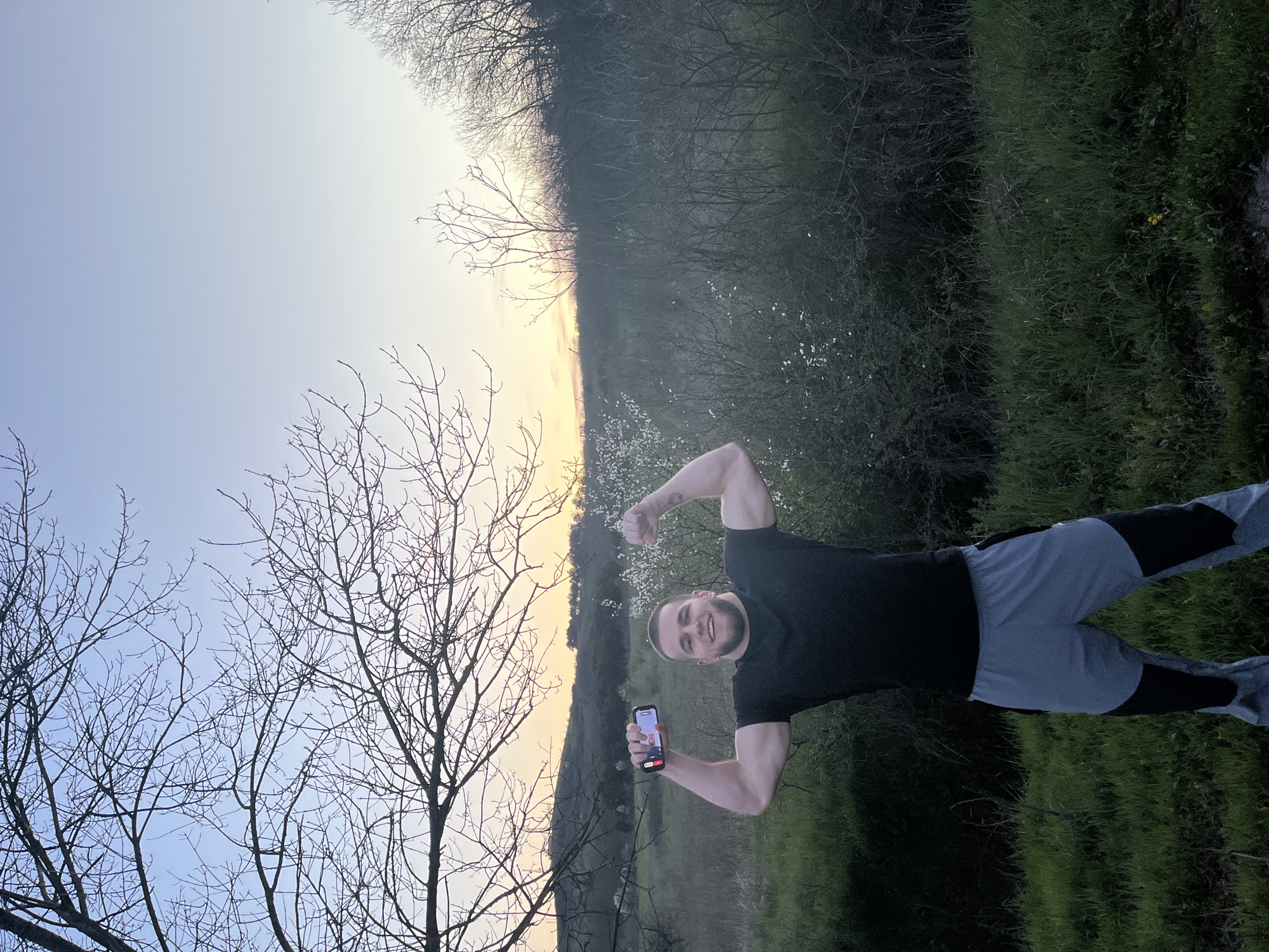 Man poses with phone in field near Burgas, Bulgaria