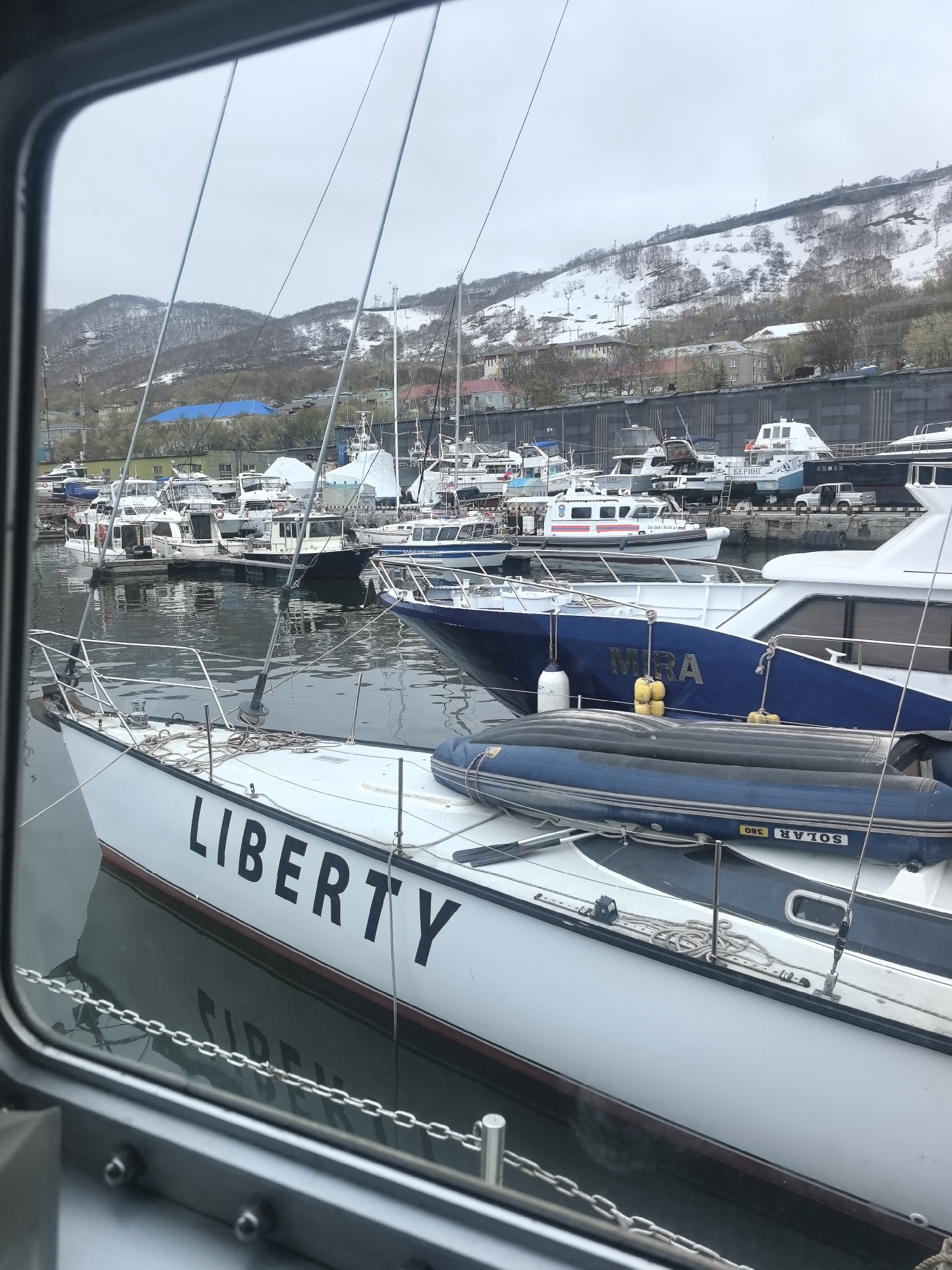 Harbor scene documented in Petropavlovsk-Kamchatsky with docked boats