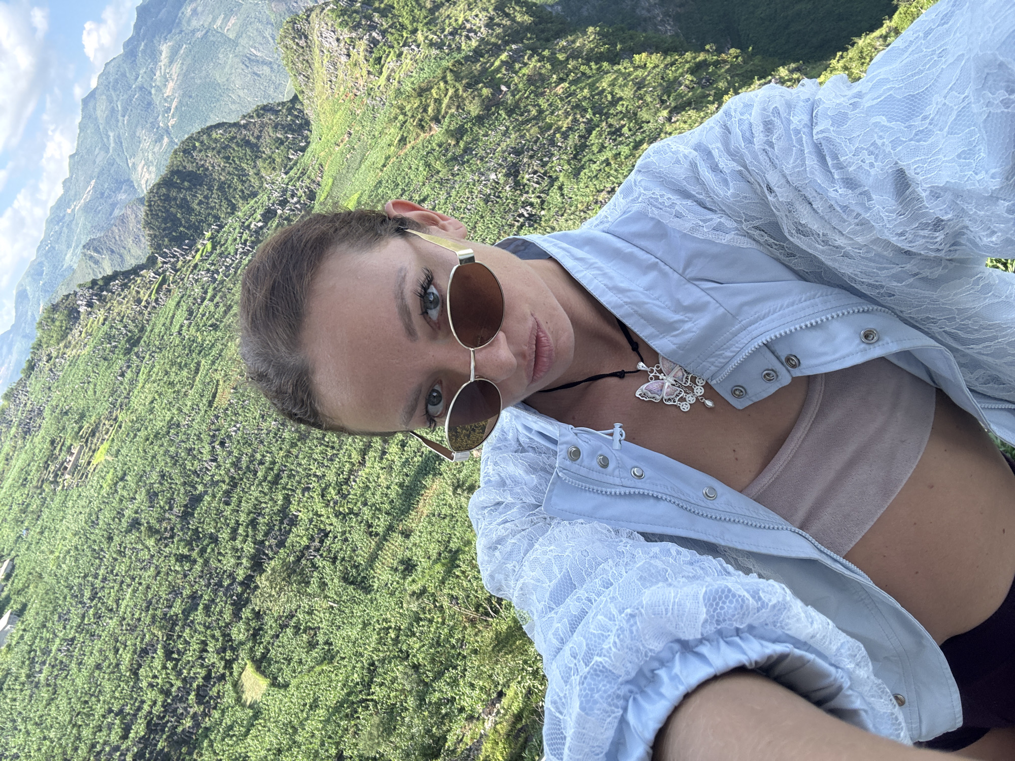 Tourists photograph scenic mountain valley overlook in northern Vietnam