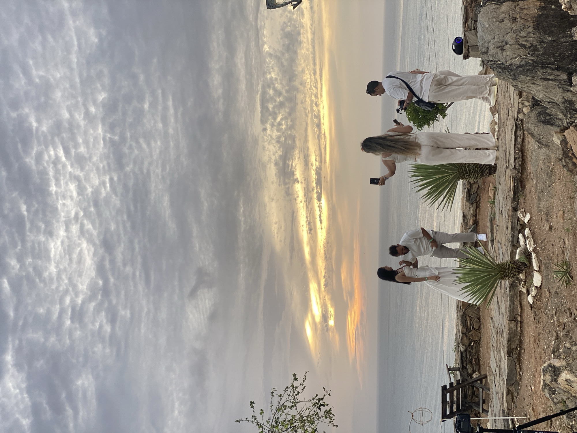 Marriage proposal captured at Juan Griego coastal overlook during sunset