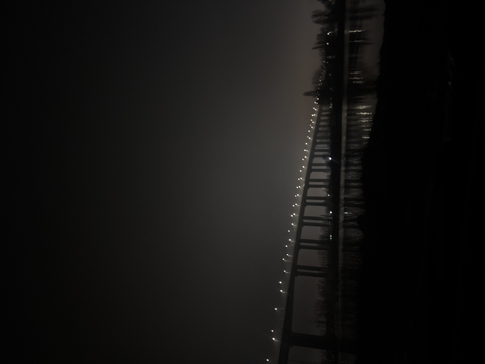 Foggy night scenes captured around illuminated Varna bridge