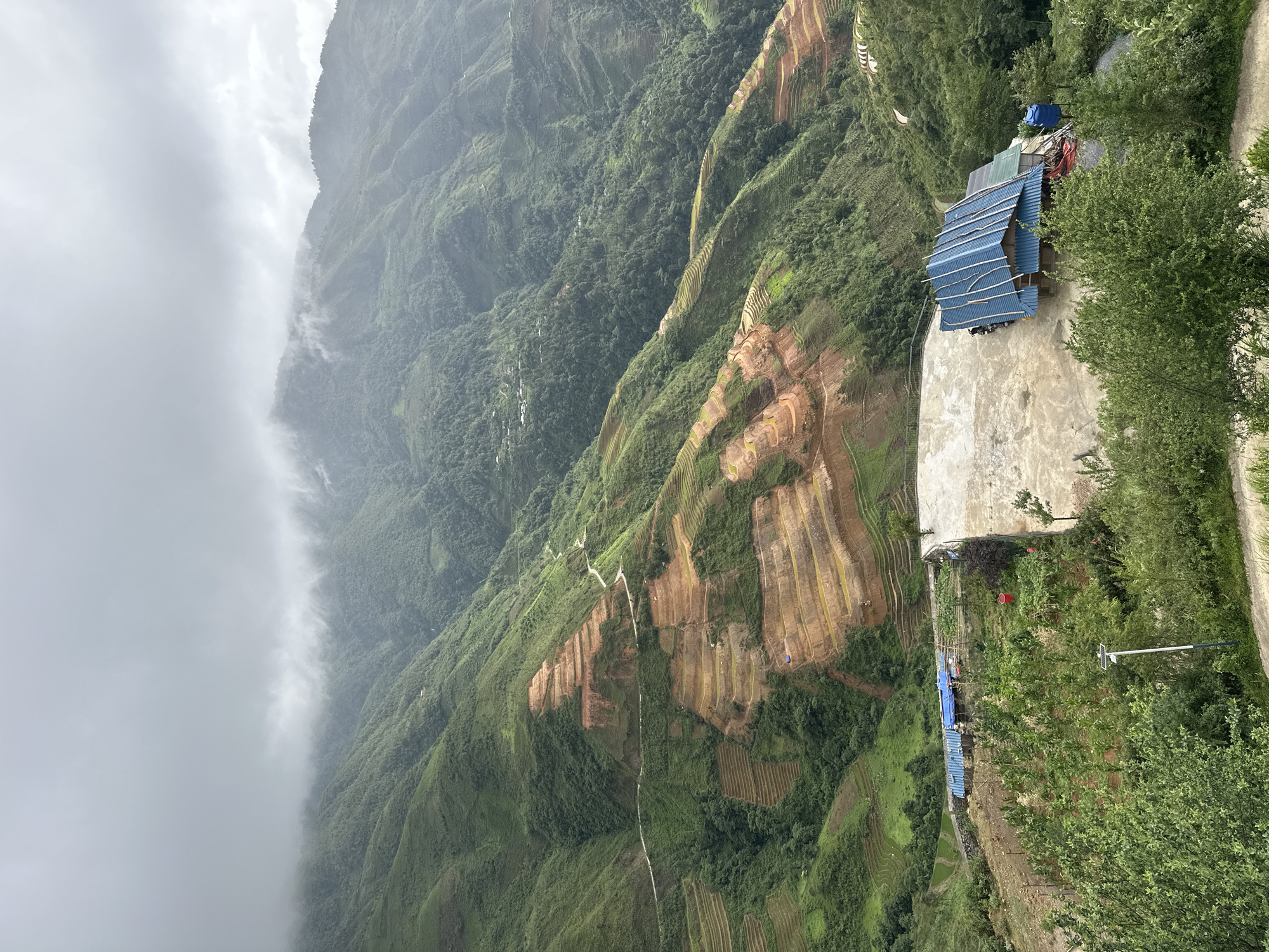 Rural dwelling photographed amid Ta Xua's terraced mountain landscape