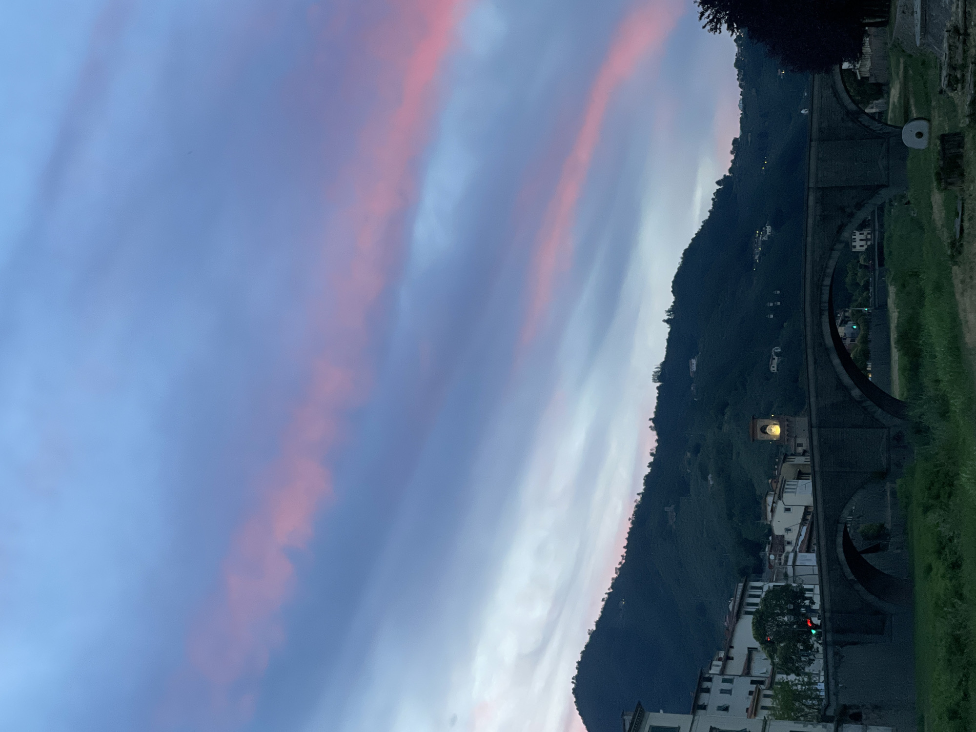 Summer evening in Pescia — streets, blooms, and candlelit tables