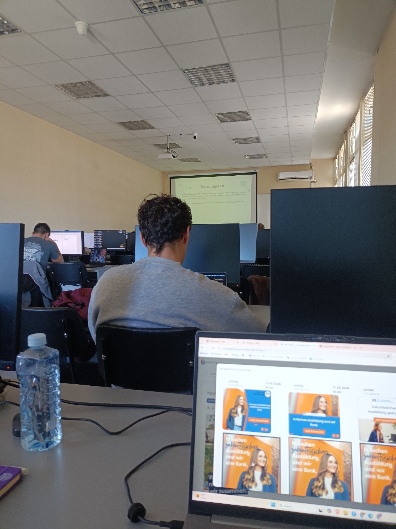 Computer workspaces documented showing recruitment ads and German website