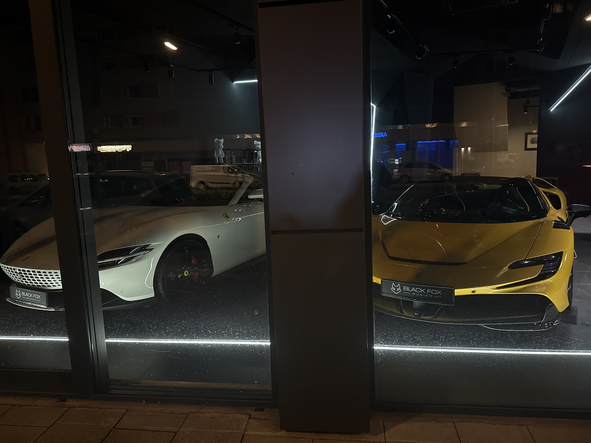 Luxury cars spotted outside Munich storefront Tuesday evening