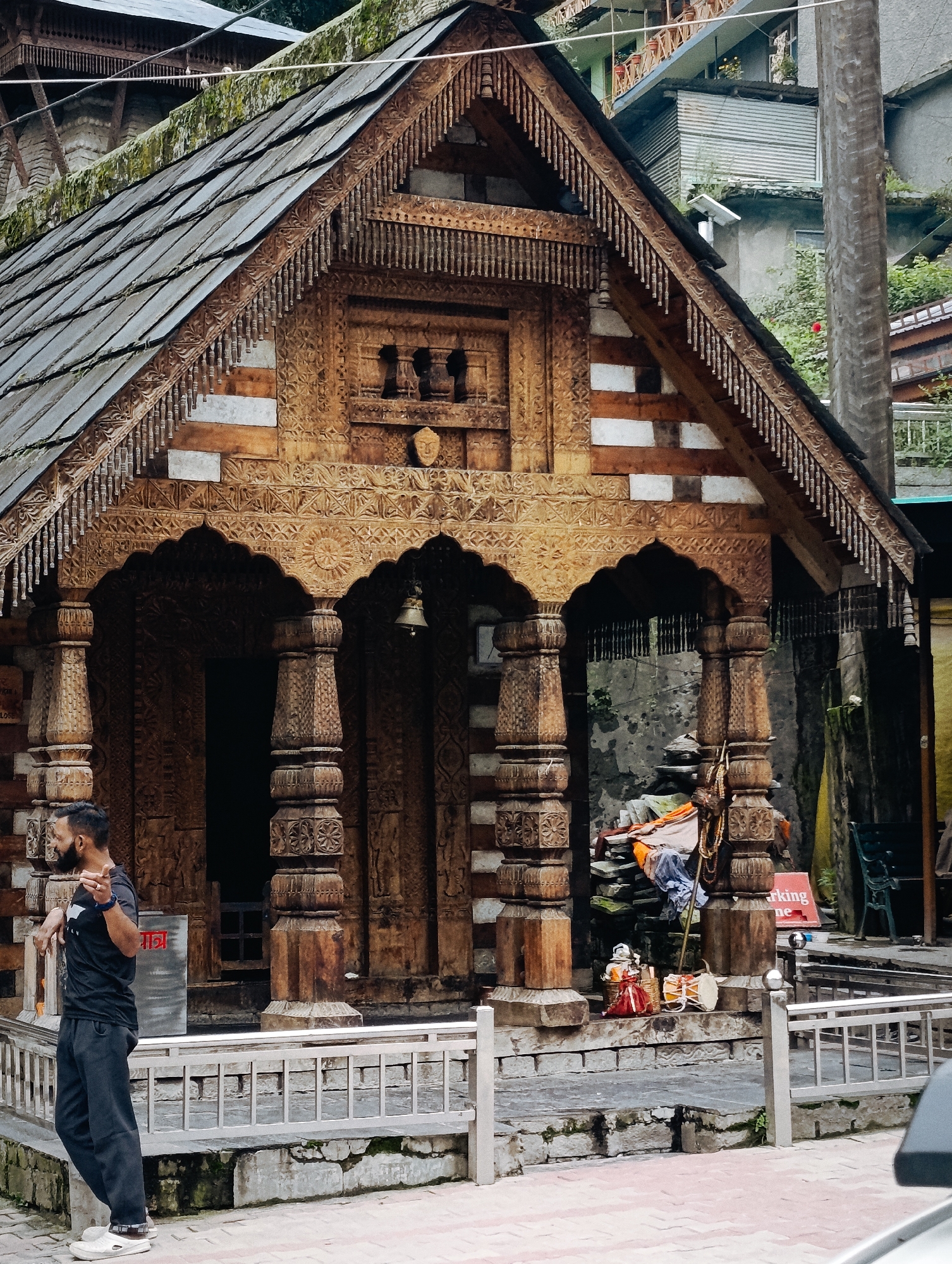 Morning life around Vashisht's carved wooden temple