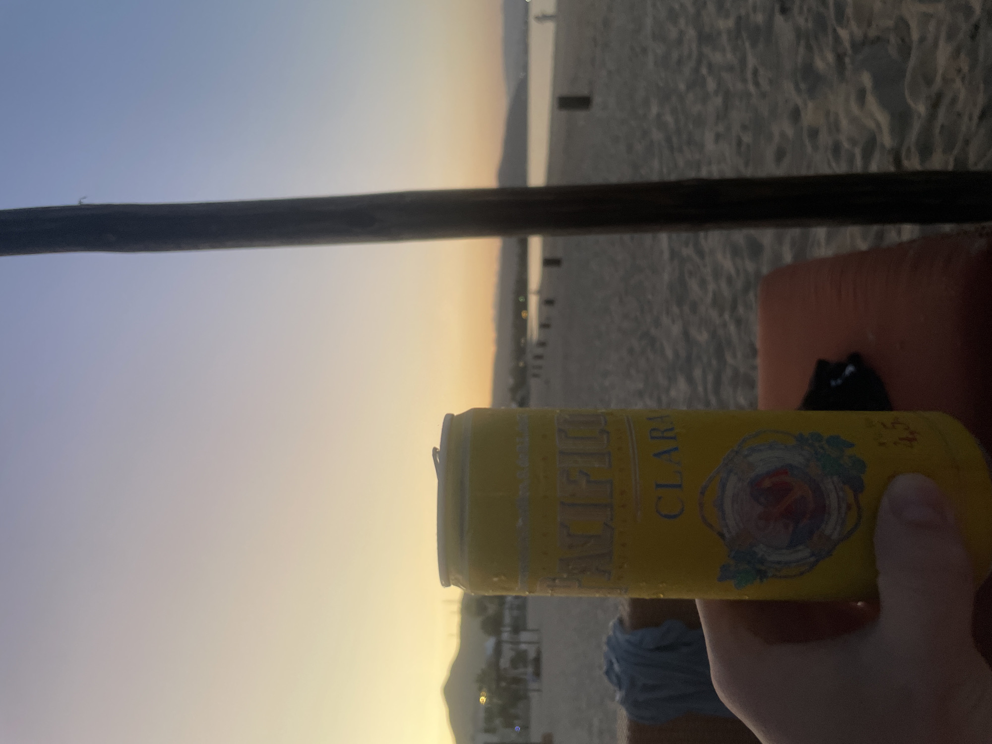 Beach moments captured with beer during sunset in Buenavista