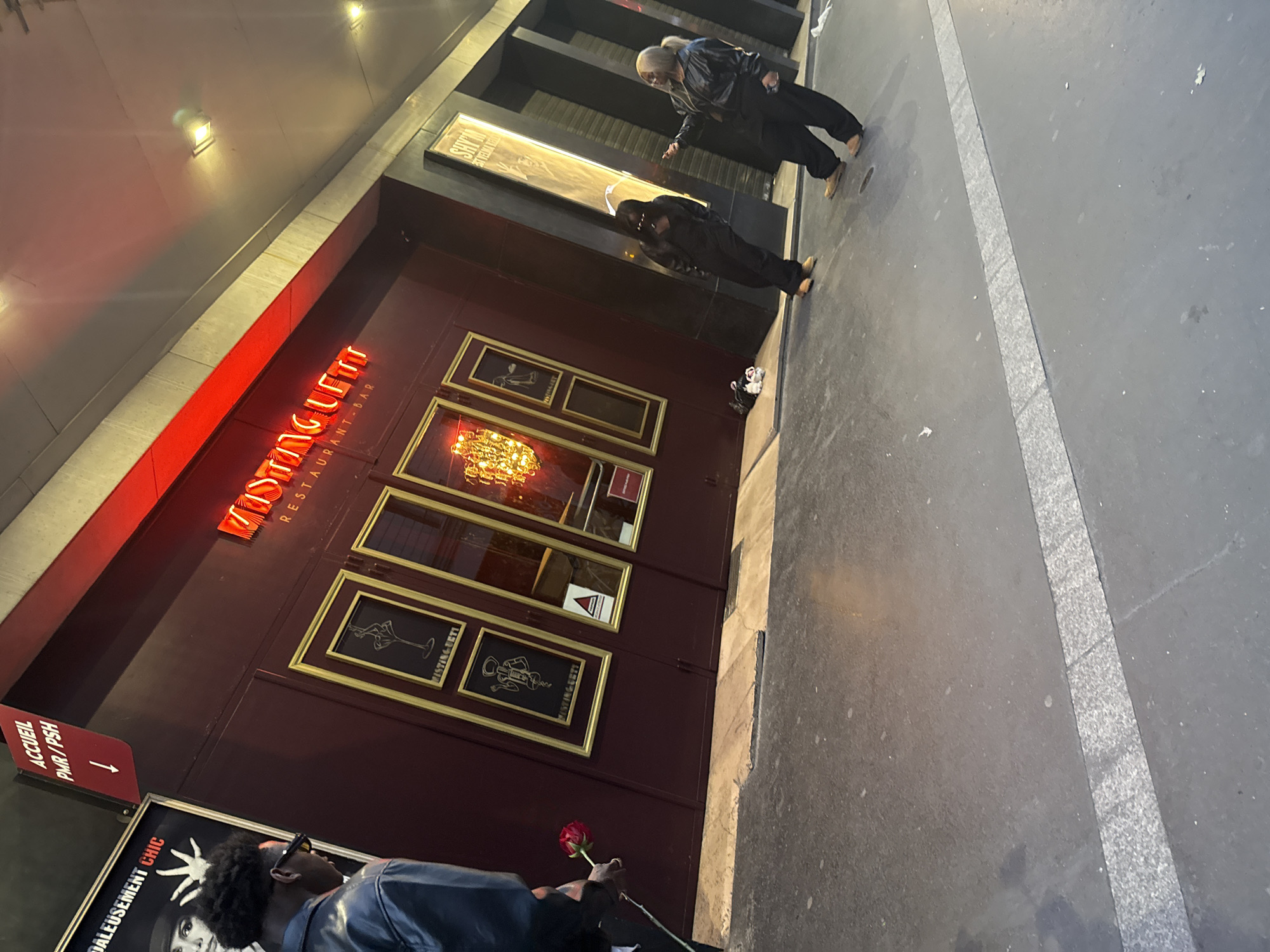 Evening activity documented near Paris restaurant during dusk hours