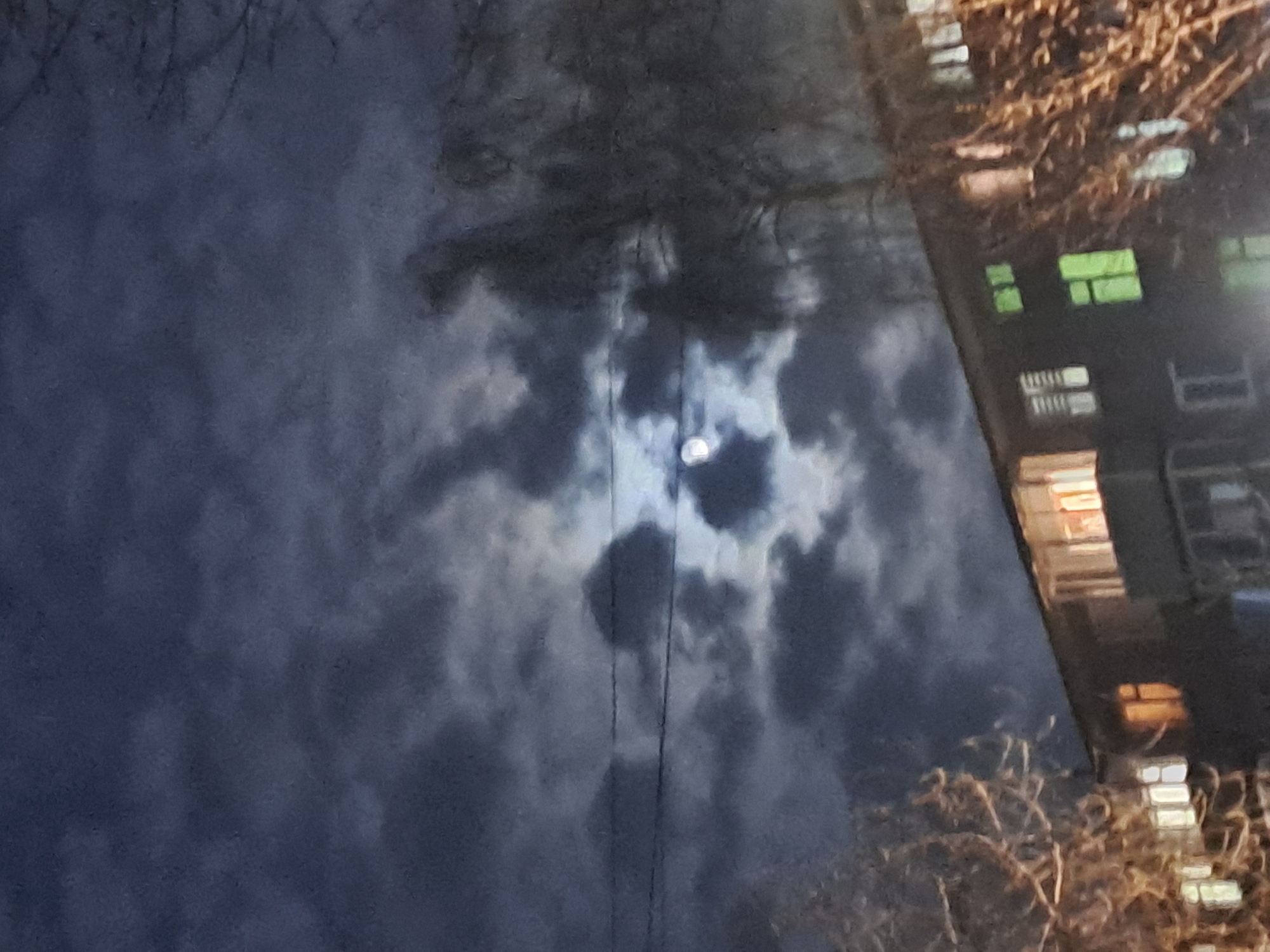 Night scenes captured in Elektrostal showing residential buildings, moon