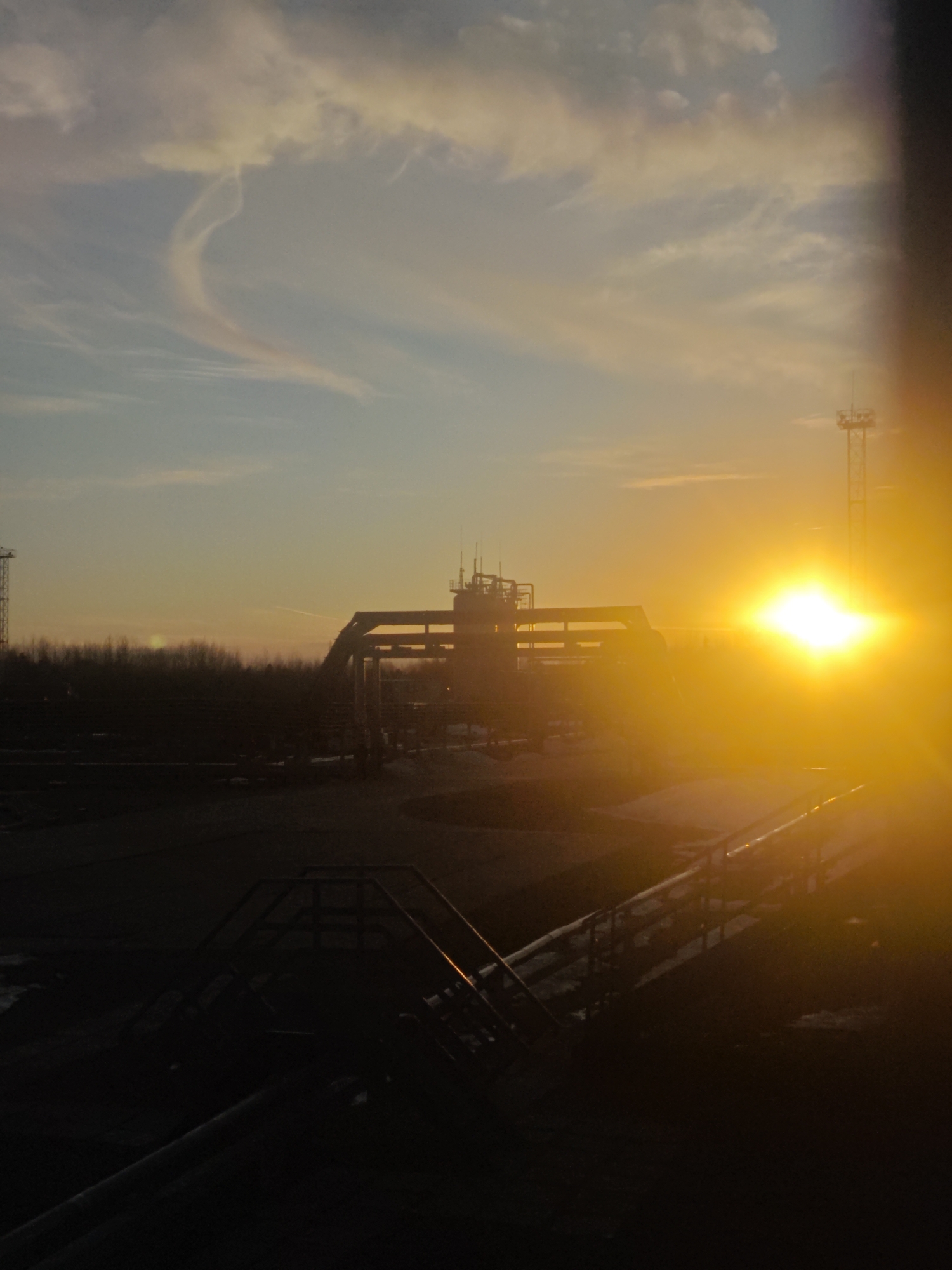 Industrial flare stacks burn at Russian facility