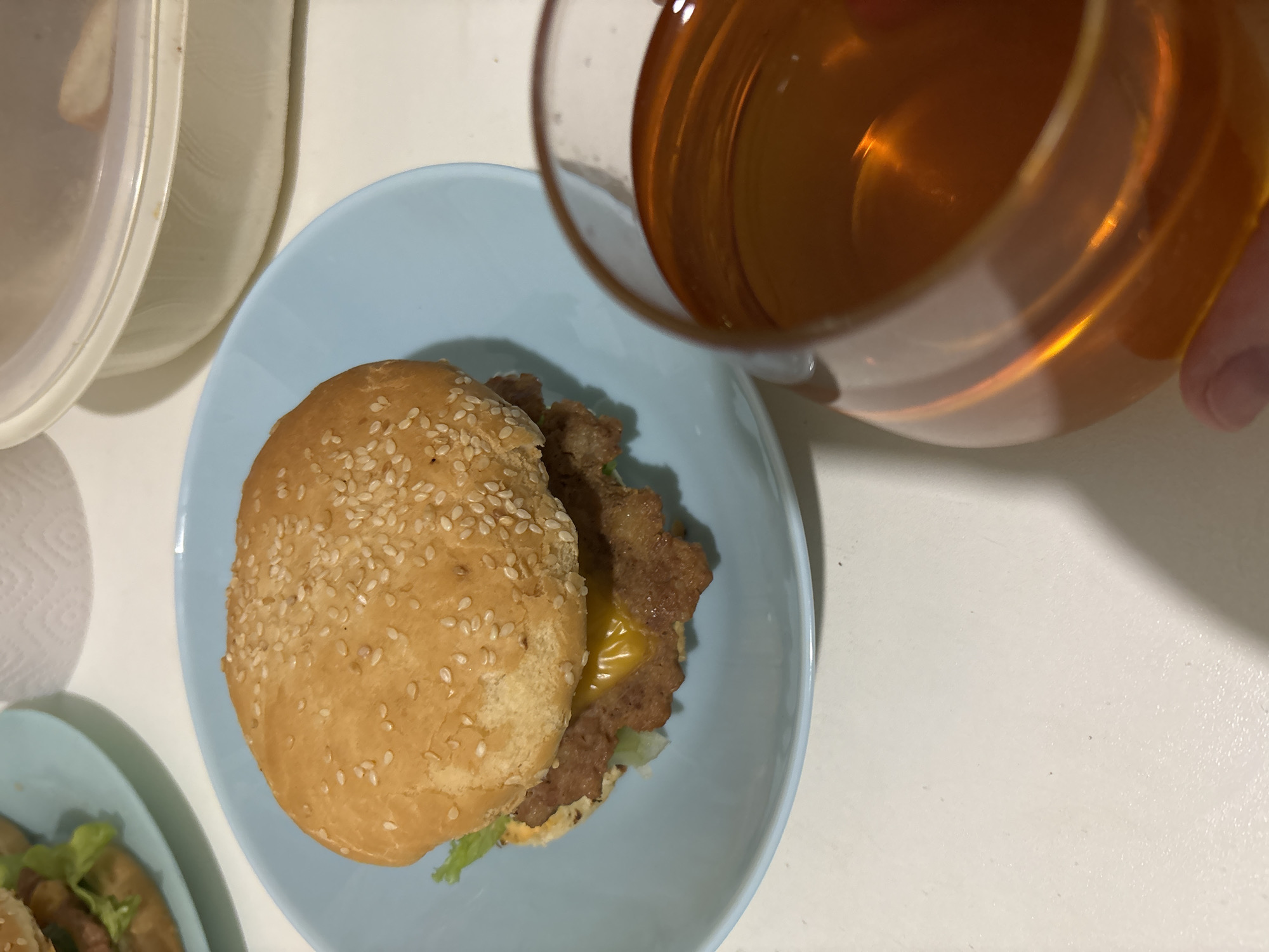 Dinner documented: burgers served on plates in Chaikovsky