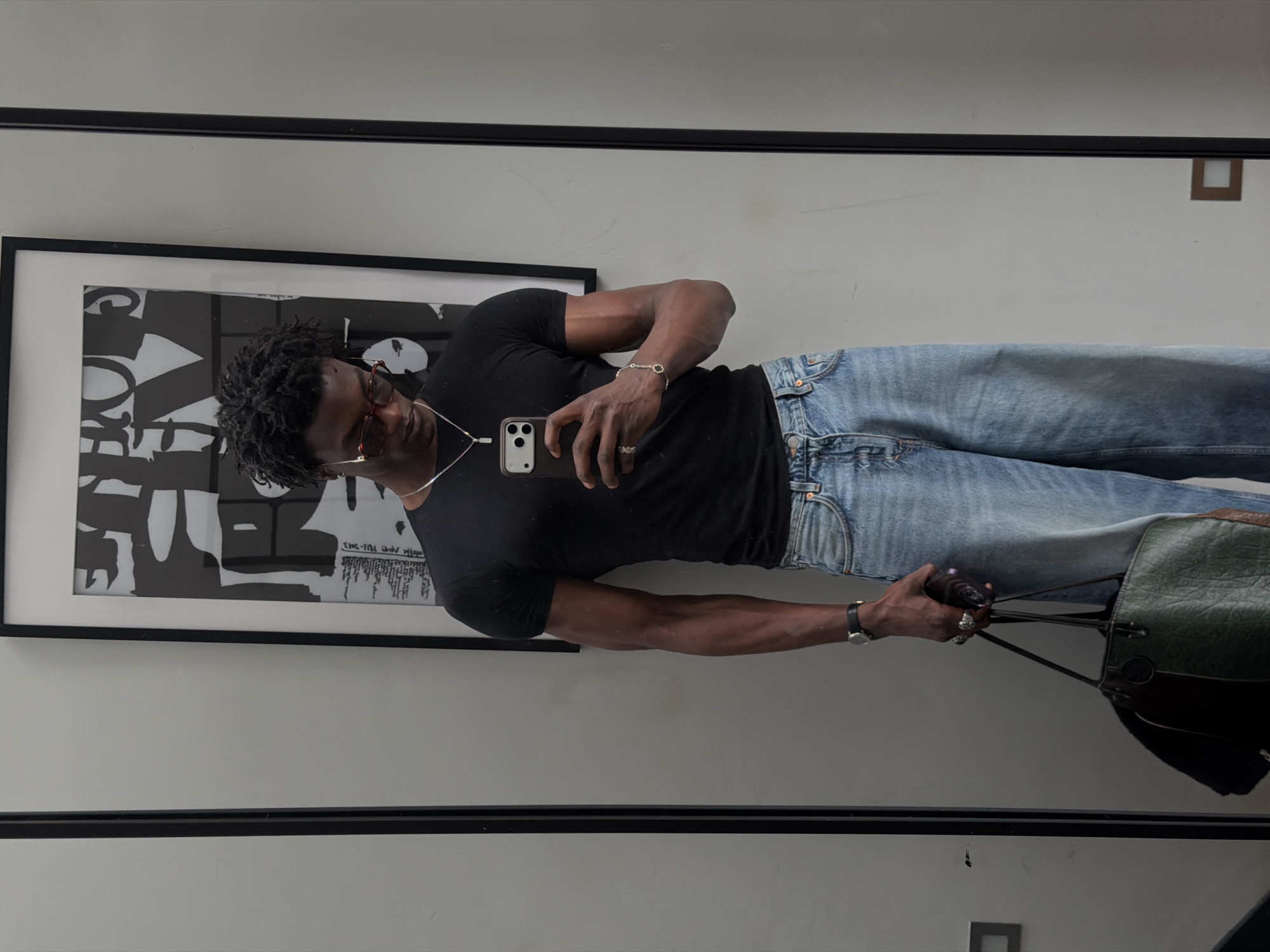 Man takes mirror selfie in London indoor location