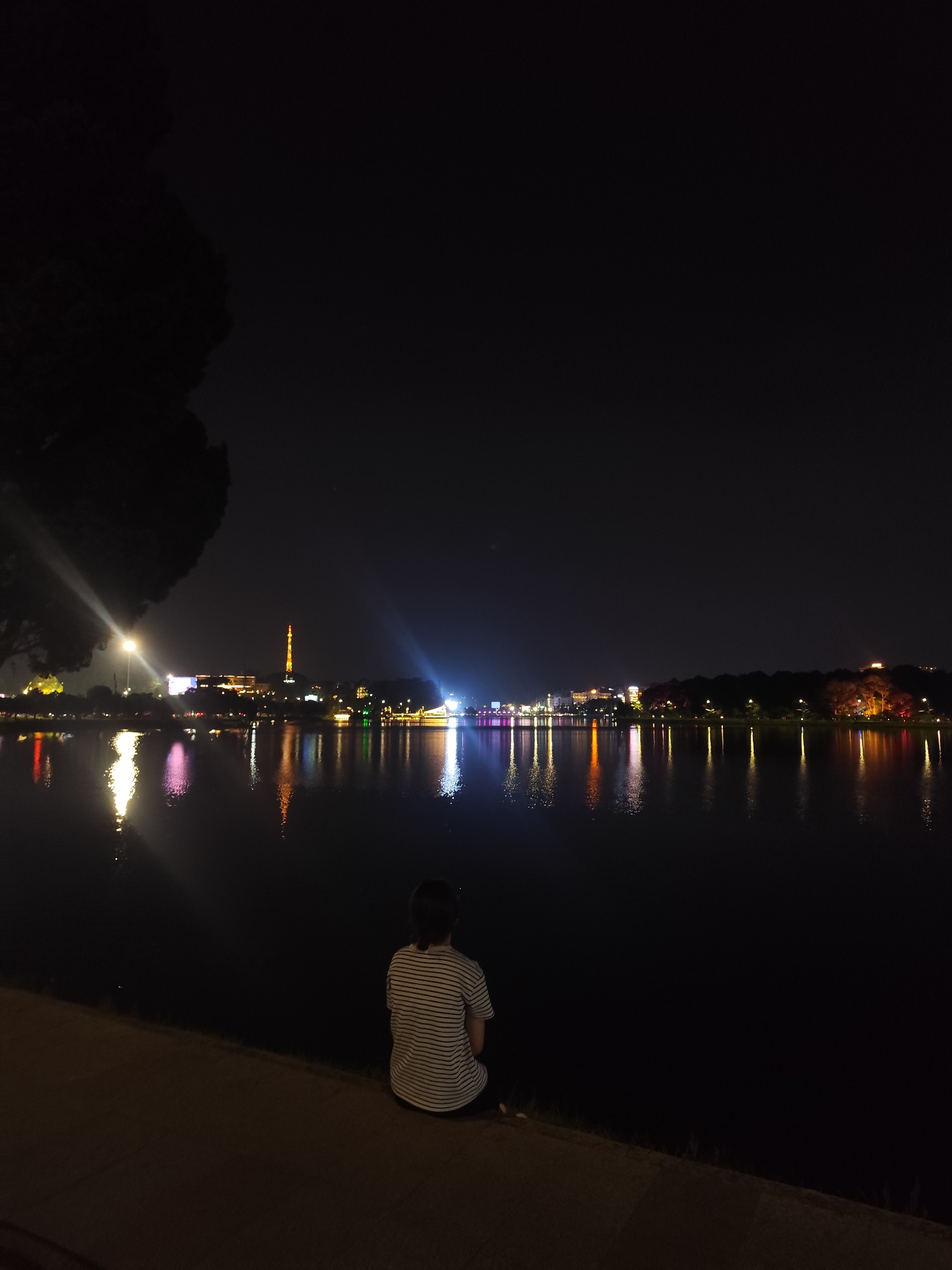 Evening lakeside activities observed at Ho Xuan Huong Lake