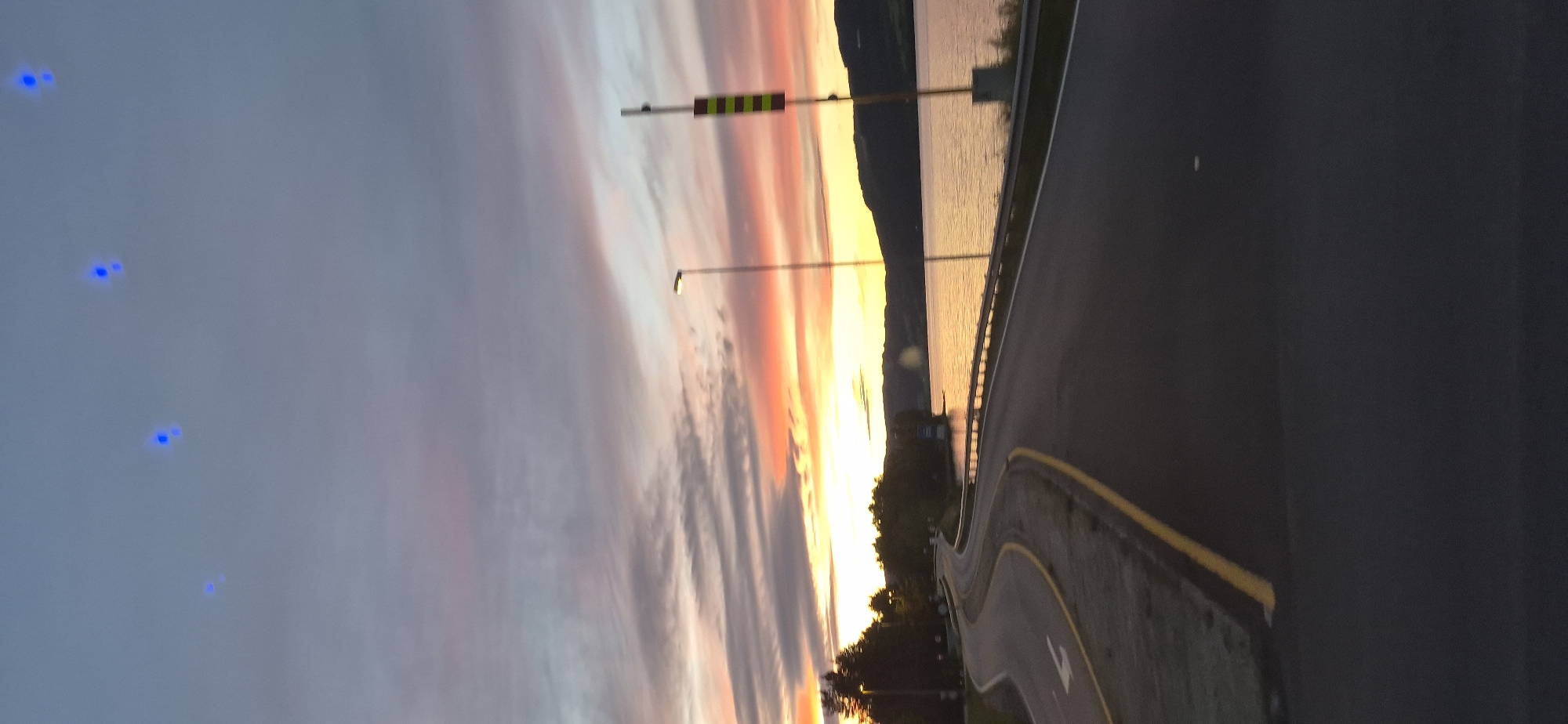 Summer twilight colors over a Norwegian fjord road
