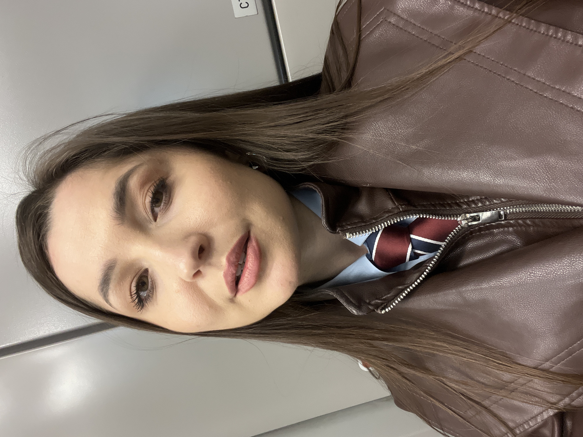 Woman in brown leather jacket photographed in Moscow