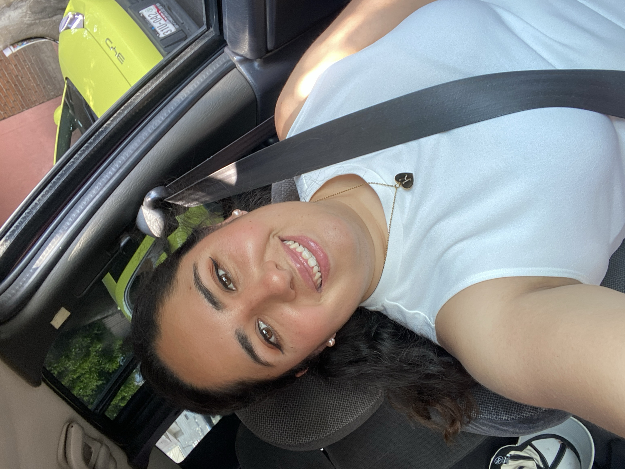Woman photographed smiling in car in Puebla, Mexico