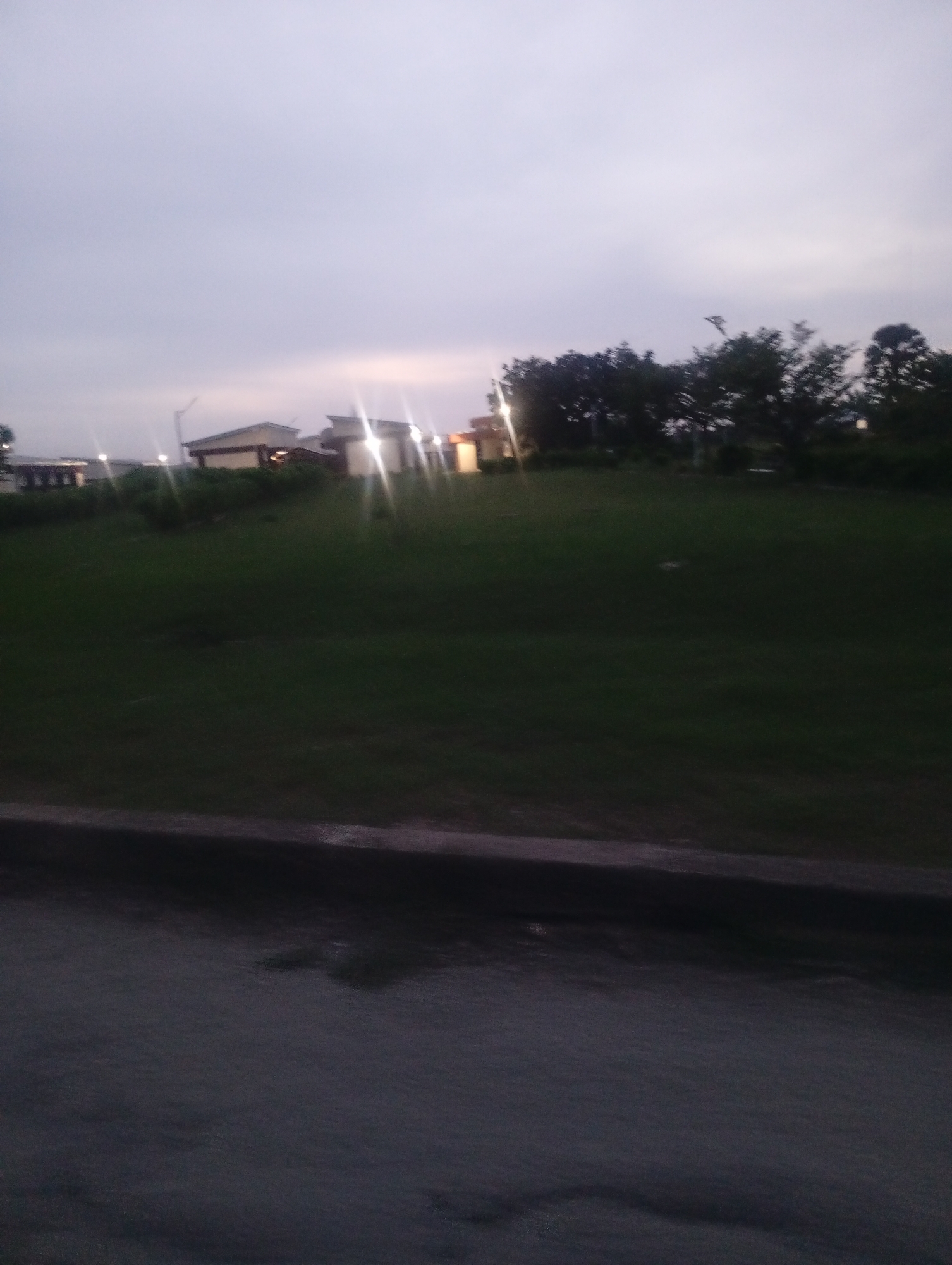 Evening activity across an institutional campus in Jos, Nigeria