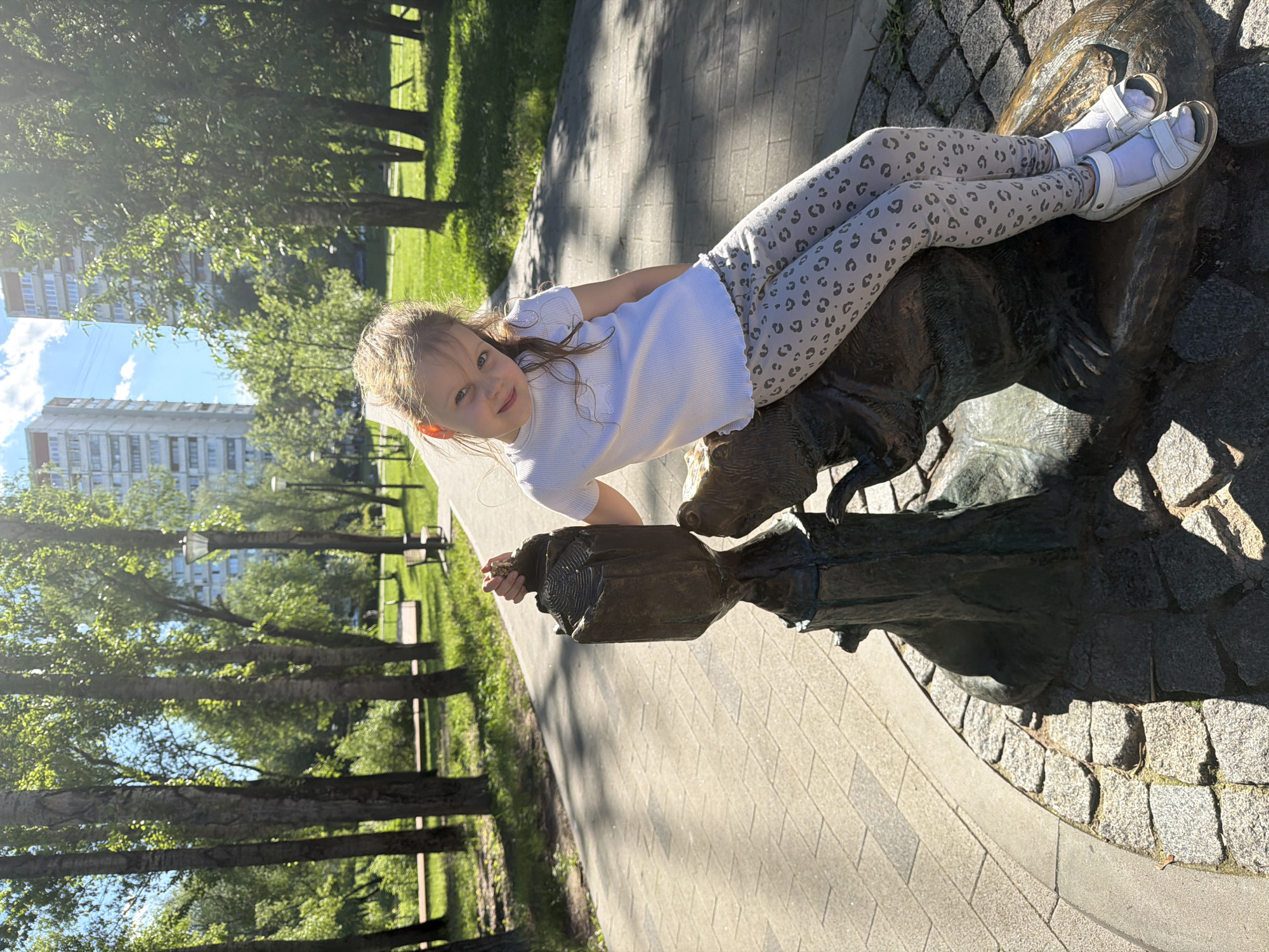 Sunny afternoon in a Moscow park with wildlife and peonies