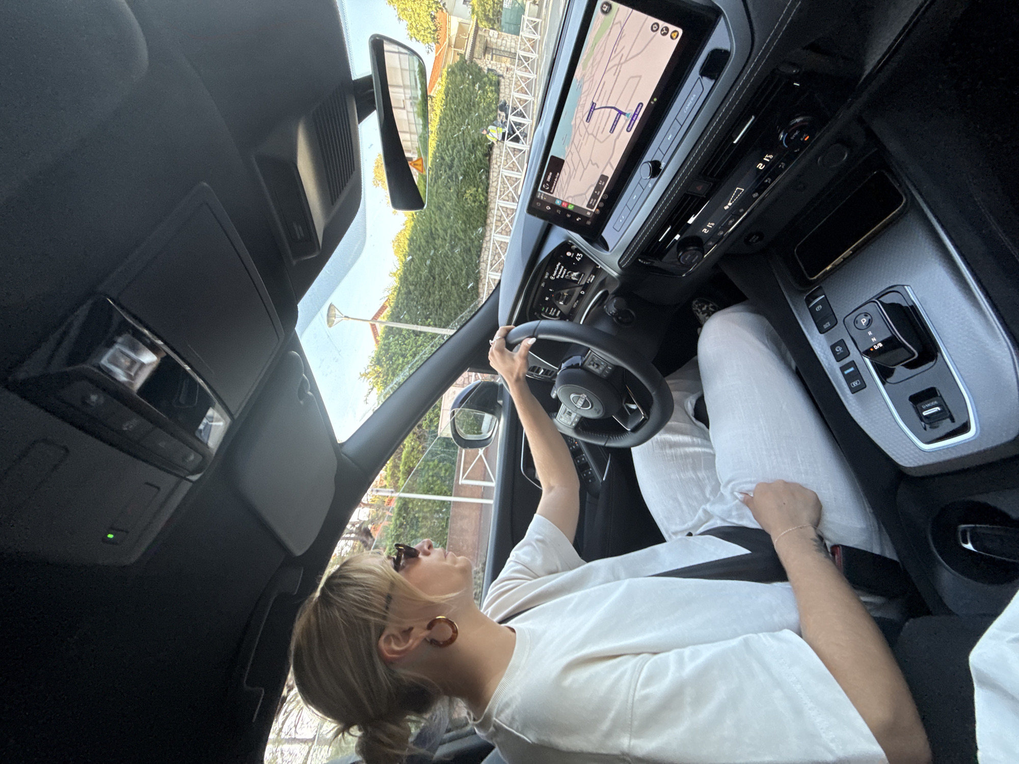 Woman photographed in car driver's seat in Antibes, France