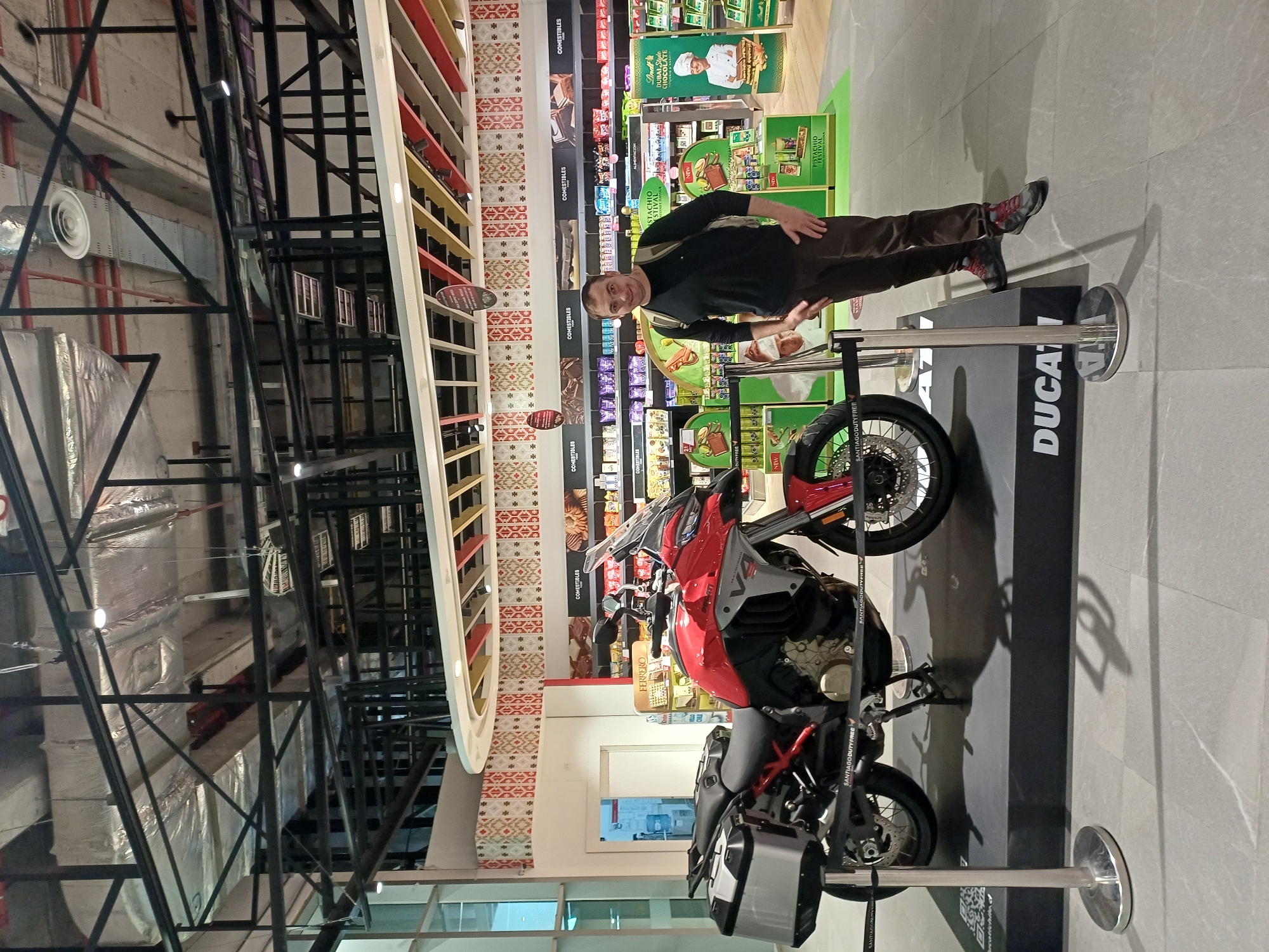 Red Ducati on display at Santiago Airport duty-free shop
