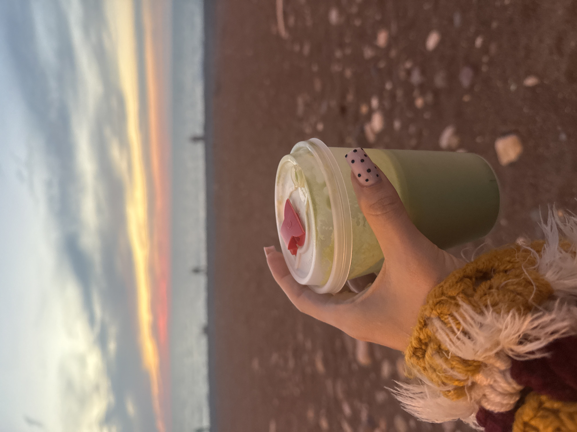 Evening sunset and beverage captured in coastal Batumi