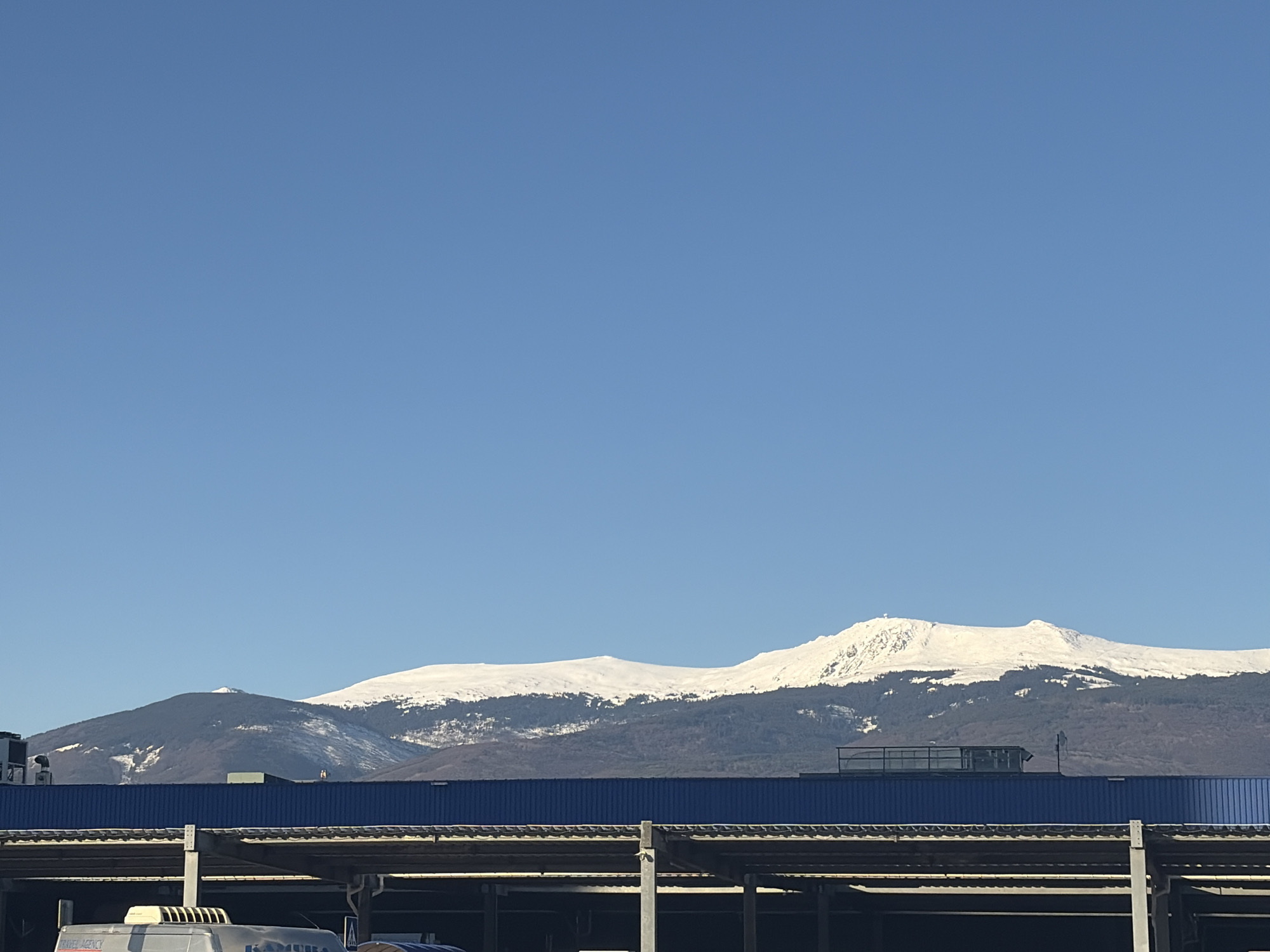 Snow-covered Vitosha Mountain visible from Sofia urban location