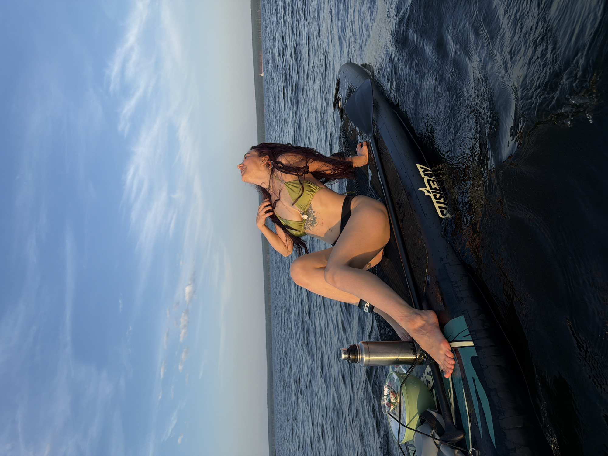Summer water recreation on a wide Russian river in Chaikovsky