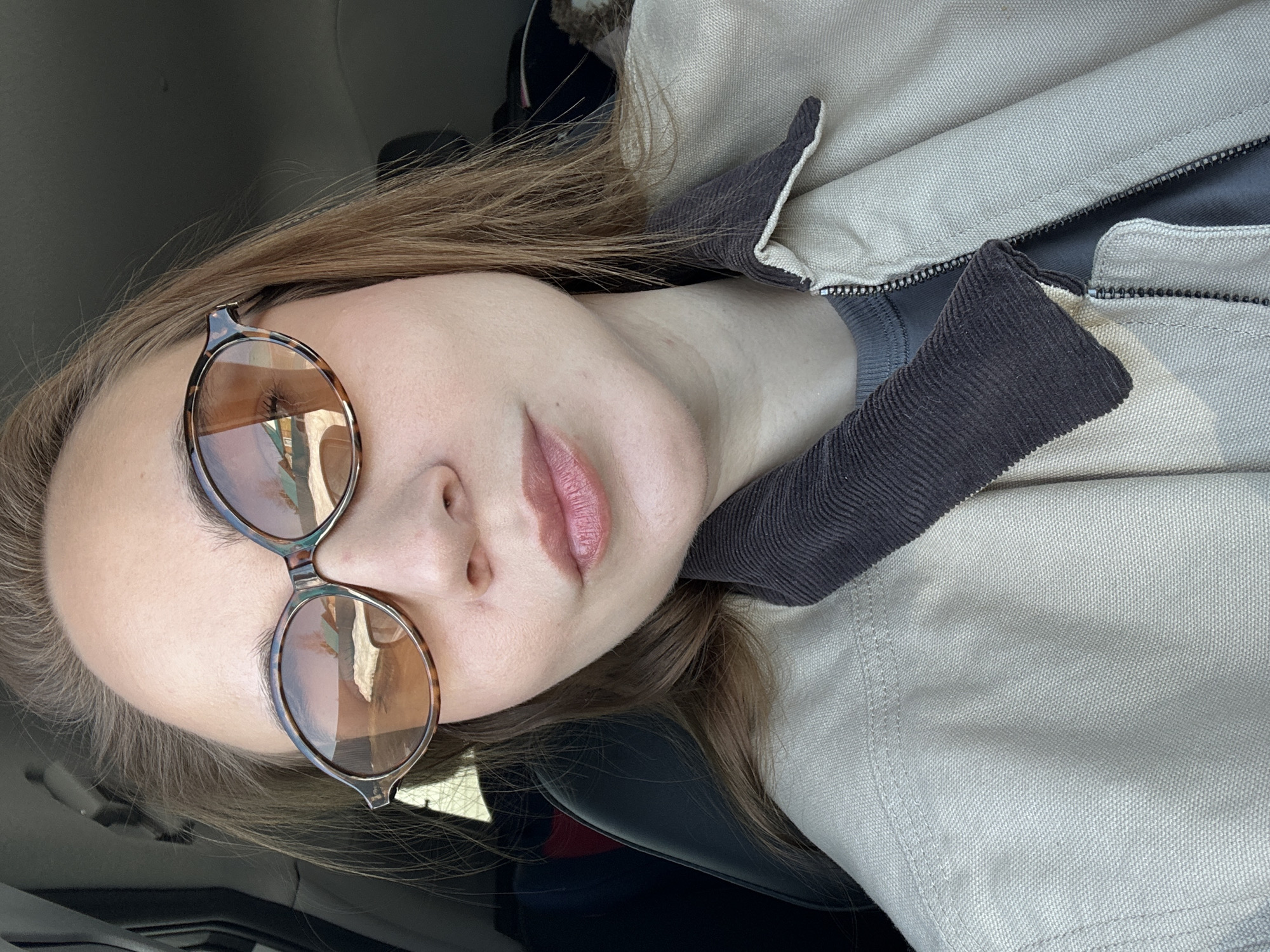Woman takes selfies in vehicle, residence in Kharnavy, Russia